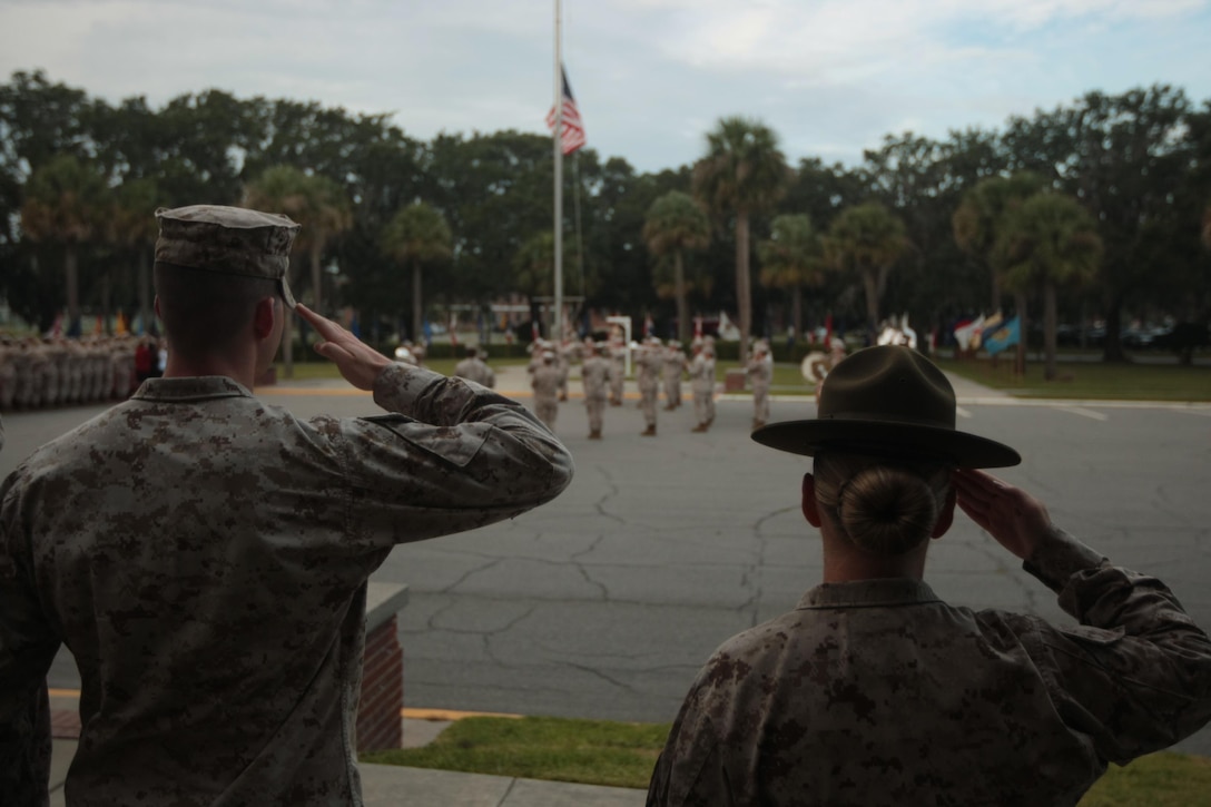 Marines from across Parris Island, S.C., salute the nation's flag Sept. 11, 2013, during a commemorative ceremony dedicated to the lives lost on 9/11. The terrorist attack was the greatest tragedy on U.S. soil since the Japanese attack on Pearl Harbor in 1941. (Photo by Cpl. Caitlin Brink)