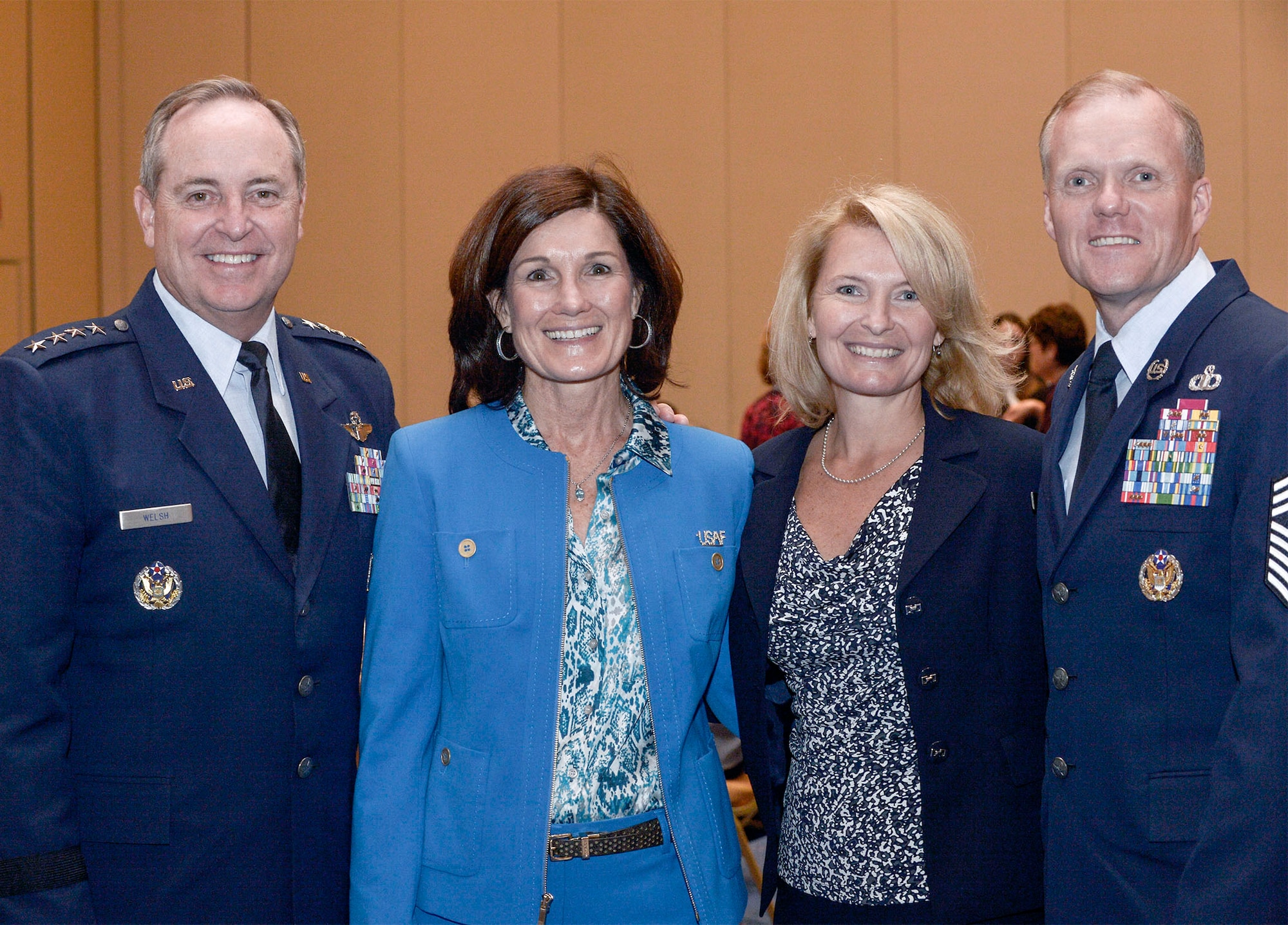 Air Force Chief of Staff Gen. Mark A. Welsh III, (left to right) his wife Betty, Athena Cody and Chief Master Sgt. of the Air Force James A. Cody pose for a photo at the Air Force Association's 2013 Air & Space Conference and Technology Exposition Sept.16, 2013, in Washington D.C. Betty and Athena addressed Family Spouse Forum attendees concerning unique issues facing military spouses and family members such as multiple deployments, child care and education. (U.S. Air Force photo/Michael J. Pausic)