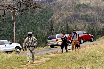 2nd General Support Aviation Battalion, 4th Combat Aviation Brigade, 4th Infantry Division, soldiers evacuate people from homes between Boulder, Colo. and Lyons, Colo., as part of search and rescue operations, Sept. 14, 2013. 4th CAB was able to assist state and local emergency response efforts under the Immediate Response Authority.