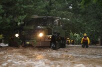 Colorado National Guardsmen and civilian first responders perform rescue operations using a Light Mobility Tactical Vehicle in Boulder County, Colo., Sept.12, 2013. (U.S. Army National Guard photo by Sgt. Joseph K. VonNida/RELEASED) 