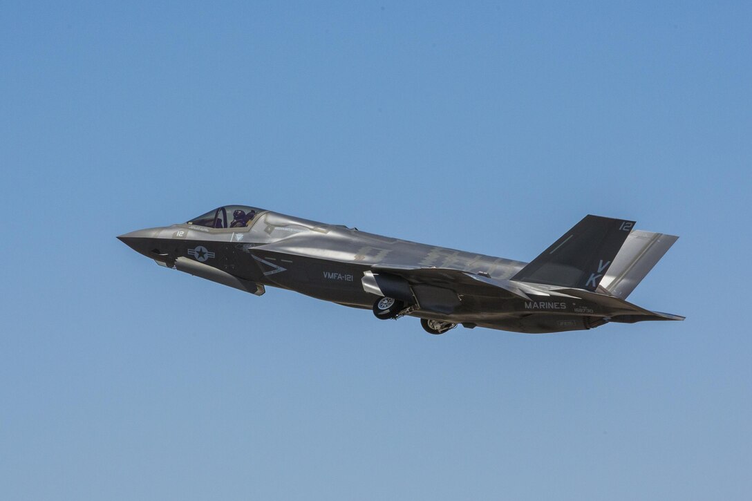 An F-35B Lightning II from Marine Fighter Attack Squadron 121 out of Marine Corps Air Station Yuma, Ariz., retracts its landing gear shortly after takeoff, Thursday. This F-35B is one of four to simultaneously embark, the first time the F-35B has achieved this milestone, on a training mission over the Arizona desert.