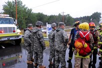 Colorado National Guardsmen respond to floods in Boulder County, Colo., Sept.12, 2013. CONG are working with local agencies to help citizens in the area affected by the flooding by evacuating people using high-clearance vehicles. (Army National Guard Photo by Sgt. Joseph K. VonNida/RELEASED)