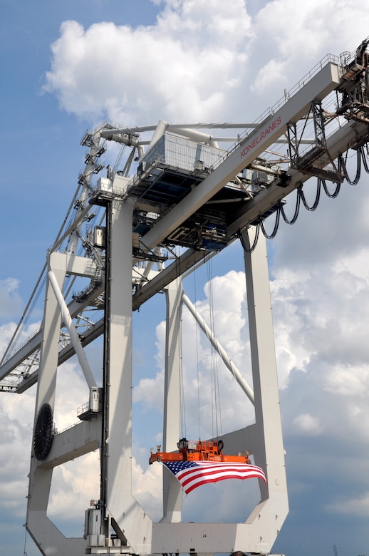 SAVANNAH, Ga.–An American flag hangs from a massive cargo crane at the Garden City Ocean Terminal to commemorate a visit by Vice President Joe Biden, Sept. 16, 2013. U.S. Army Corps of Engineers' photo by Tracy Robillard.