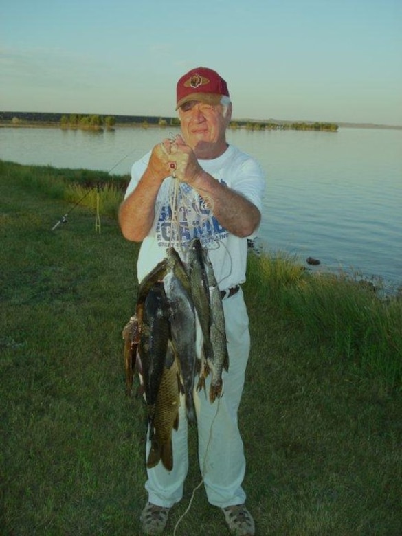 Proof that he can catch a few fish, Johnson's favorite fishing spots are the shafts, Duck Creek and behind the Interpretive Center. He says his spare time is spent fishing and smoking fish.