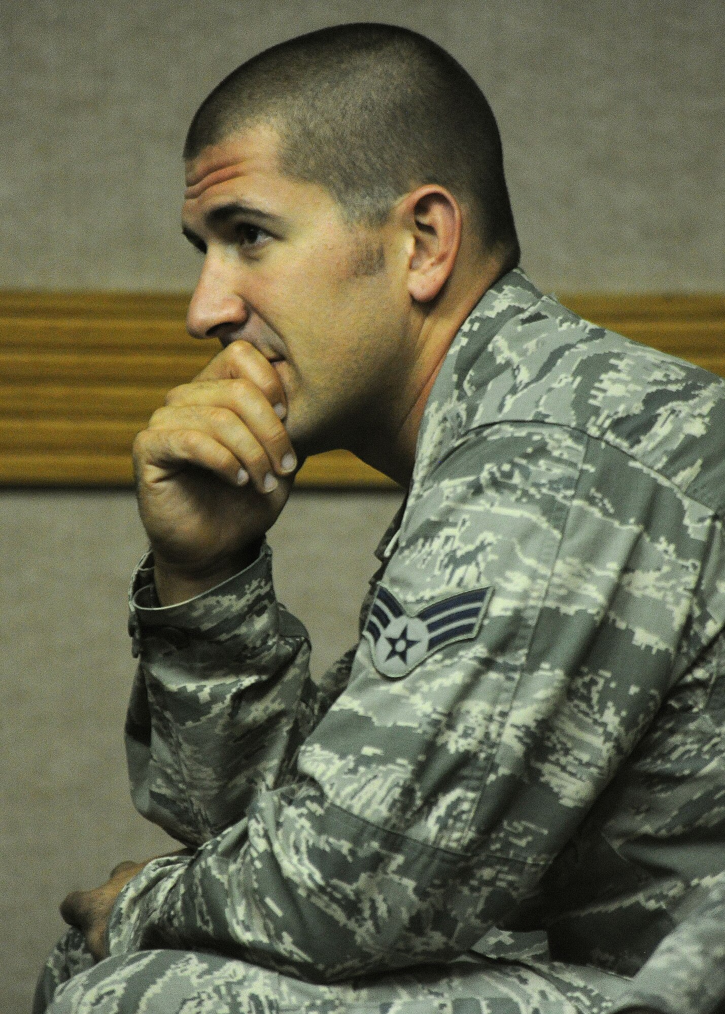 An airman from Airman Leadership Class 13-D listens attentively to Retired Chief Master Sgt. Robert D. Gaylor at Binnicker Professional Military Education Center at Joint Base Pearl Harbor-Hickam, Hawaii, Sept. 12, 2013. Gaylor took the opportunity to speak to students about what he believed are the three successes to life: to be physical fit, financially stable, and to be highly educated. Gaylor is the fifth chief master sergeant of the Air Force. (U.S. Air Force photo/Tech. Sgt. Jerome S. Tayborn)