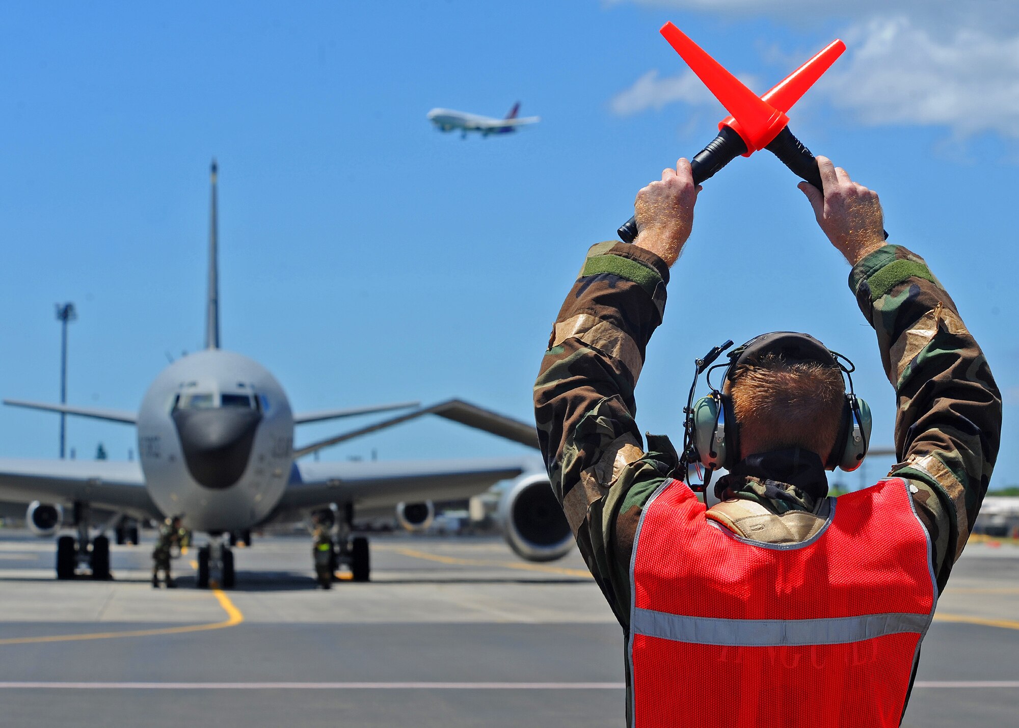 Staff Sgt. John Sciolto, Hawaii Air National Guard 154th Aircraft Maintenance Squadron crew chief prepare to launch a KC-135 Stratotanker on the flightline during an Operational Readiness Exercise at Joint Base Pearl Harbor-Hickam, Hawaii, Sept. 11, 2013. The exercise participants were tested on their ability to properly react to a broad range of scenarios and environmental conditions. (U.S. Air Force photo/Tech. Sgt. Jerome S. Tayborn)