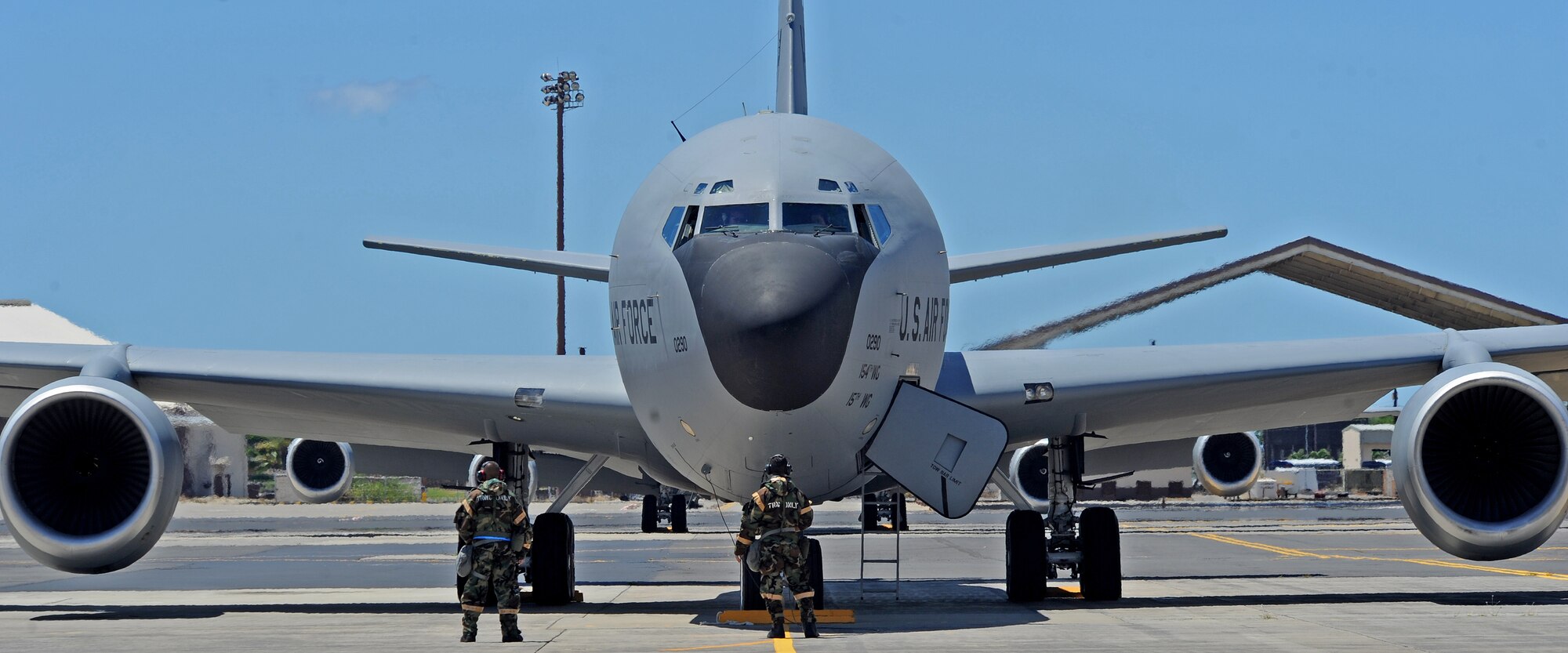 Airmen from the Hawaii Air National Guard 154th Aircraft Maintenance Squadron conduct preflight checks prior to launching a KC-135 Stratotanker on the flightline during an Operational Readiness Exercise at Joint Base Pearl Harbor-Hickam, Hawaii, Sept. 11, 2013. Airmen are drilled on donning mission-oriented protective posture gear and surviving simulated chemical attacks in an austere environment while still proceeding with the mission. (U.S. Air Force photo/Tech. Sgt. Jerome S. Tayborn)