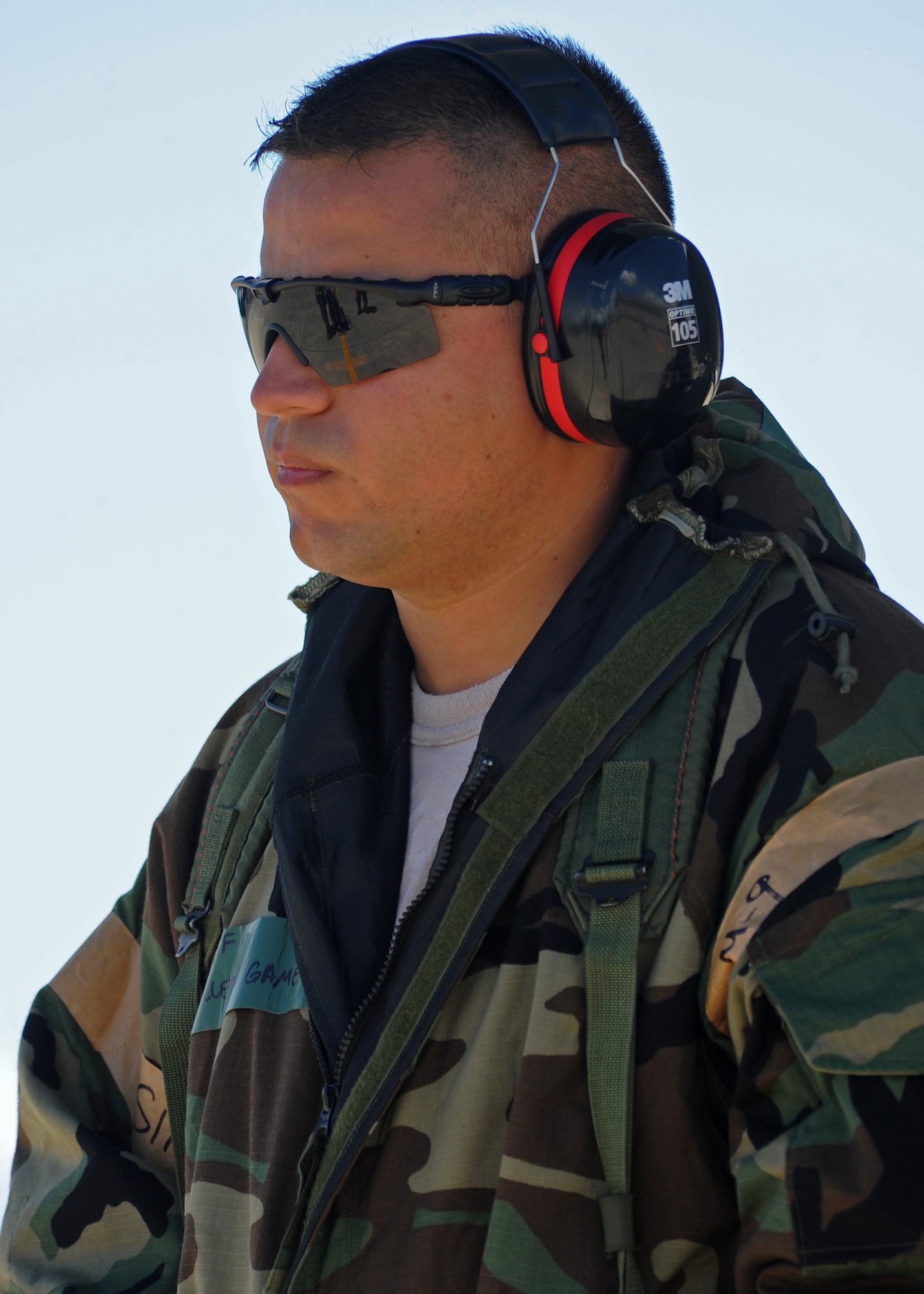 Tech. Sgt. Gaumero Guillermo, Hawaii Air National Guard 154th Aircraft Maintenance Squadron crew chief patiently awaits a call from the tower to launch a KC-135 Stratotanker on the flightline during an Operational Readiness Exercise at Joint Base Pearl Harbor-Hickam, Hawaii, Sept. 11, 2013. (U.S. Air Force photo/Tech. Sgt. Jerome S. Tayborn)