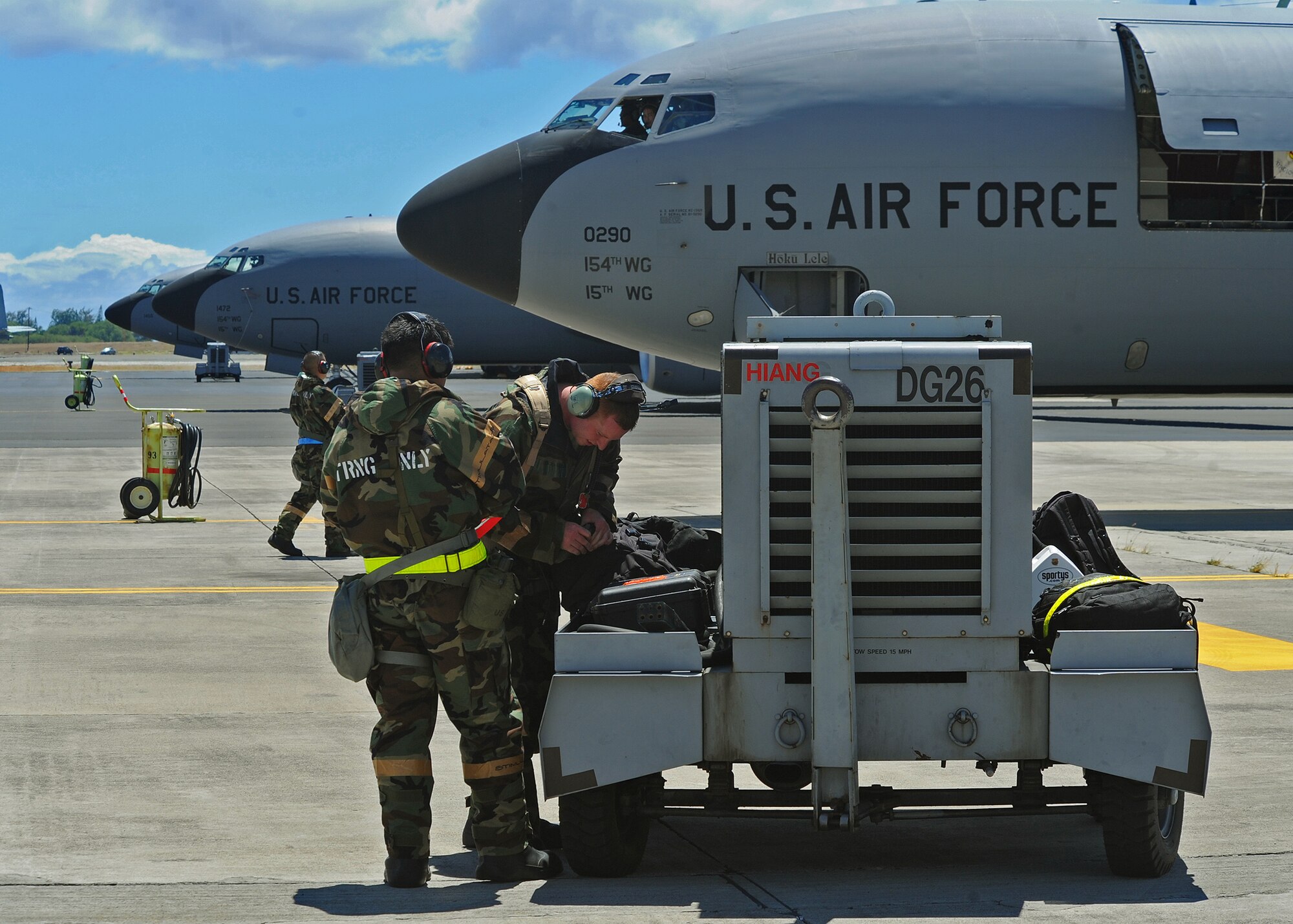 Members of the Hawaii Air National Guard 154th Aircraft Maintenance Squadron perform preflight checks prior to launching a KC-135 Stratotanker on the flightline during an Operational Readiness Exercise at Joint Base Pearl Harbor-Hickam, Hawaii, Sept. 11, 2013.  The refueling capabilities of the KC-135 aircraft are essential in today’s Air Force, and have been refueling the fleet for more than 50 years. (U.S. Air Force photo/Tech. Sgt. Jerome S. Tayborn)  
