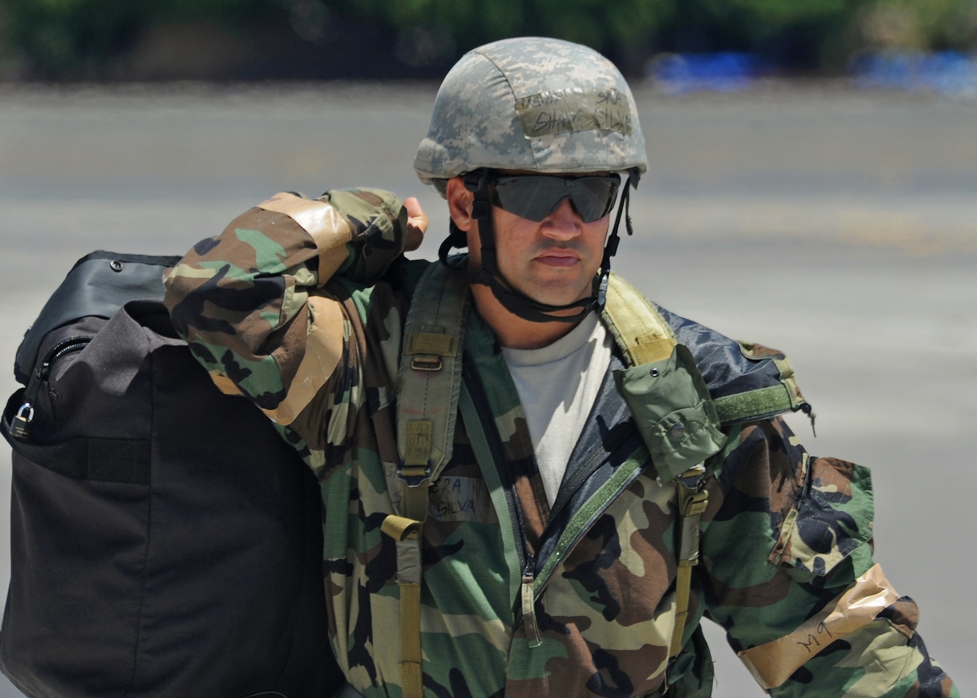 Senior Airman Shawn Silva, Hawaii Air National Guard 154th Aircraft Maintenance Squadron crew chief, reports to duty on the flightline during an Operational Readiness Exercise at Joint Base Pearl Harbor-Hickam, Hawaii, Sept. 11, 2013. (U.S. Air Force photo/Tech. Sgt. Jerome S. Tayborn)