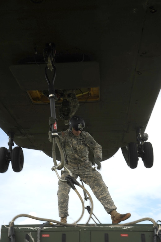 U.S. Army Staff Sgt. Tim Byrnes, a Joint Task Force-Bravo Army Forces Air Drop supervisor, attaches a 4,823 pound environmental control unit to one of 1-228 Aviation Battalion Chinook-47s, which will be used by JTF-Bravo’s Medical Element’s mobile surgical team Sept 16-21 in the Northern region of Honduras. The United States military personnel assigned to Joint Task Force-Bravo have been conducting medical readiness training exercises since Oct. 1993. Since that time, they have conducted more than 295 missions and treated more than 341,400 medical patients, 67,400 dental patients and 14,300 surgical patients throughout Central America.