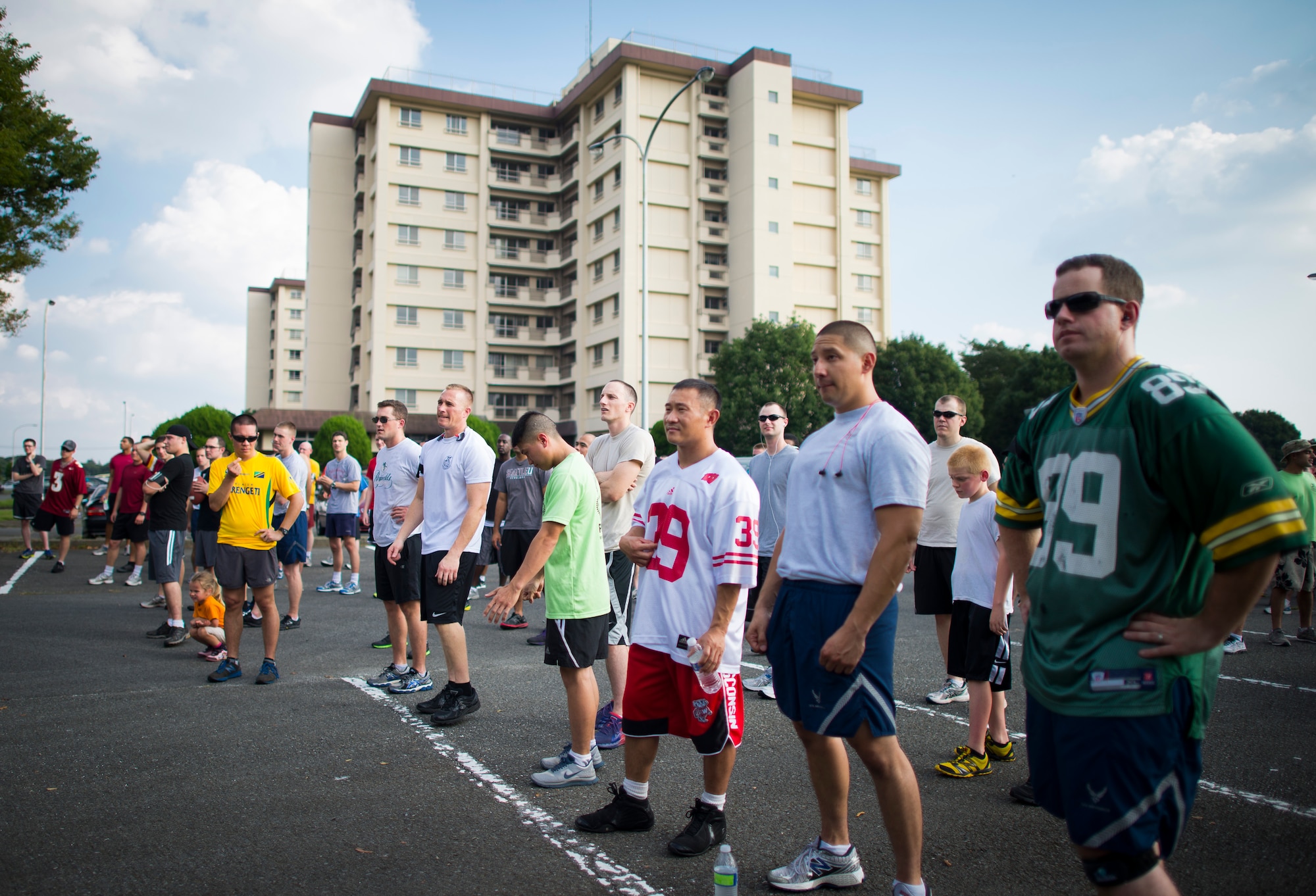Yokota service members stretch before the Combined Federal Campaign 5K Fun Run Sept. 13, 2013 at Yokota Air Base, Japan. More than 200 people ran in the event that kicked off the annual CFC campaign at Yokota. (U.S. Air Force photo by Staff Sgt. Chad C. Strohmeyer/released)