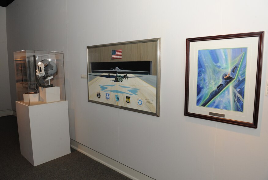 Artwork from the Air Force Art of the Atomic Age exhibit is on display in the Meadows Museum of Art, at Centenary College of Louisiana, Shreveport, La., Sept. 12, 2013. The selection is a good mix of art showcasing Air Force people, aircraft and missiles, all related to the very essence of Air Force Global Strike Command. (U.S. Air Force photo/Senior Airman Benjamin Gonsier)