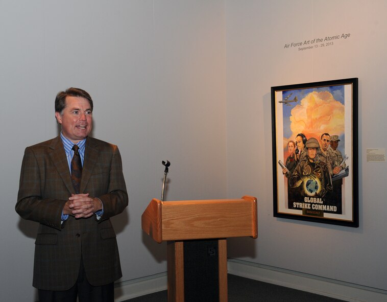 David Rowe, Centenary College of Louisiana President, speaks to attendees of the Air Force Art of the Atomic Age exhibit in the Meadows Museum of Art, at Centenary College of Louisiana, Shreveport, La., Sept. 12, 2013. The exhibit features 12 pieces of art, which highlights the Air Force Global Strike Command and the Strategic Air Command. (U. S. Air Force photo/Senior Airman Benjamin Gonsier)
