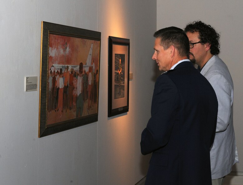 Col. Thomas Hesterman, Eighth Air Force vice commander, looks at a piece of artwork in the Meadows Museum of Art at Centenary, at College of Louisiana, Shreveport, La., Sept. 12, 2013.  The museum exhibit, Air Force Art of the Atomic Age, is currently on display at the Meadows Museum of Art until Sept. 29. (U.S. Air Force Base/Senior Airman Benjamin Gonsier)