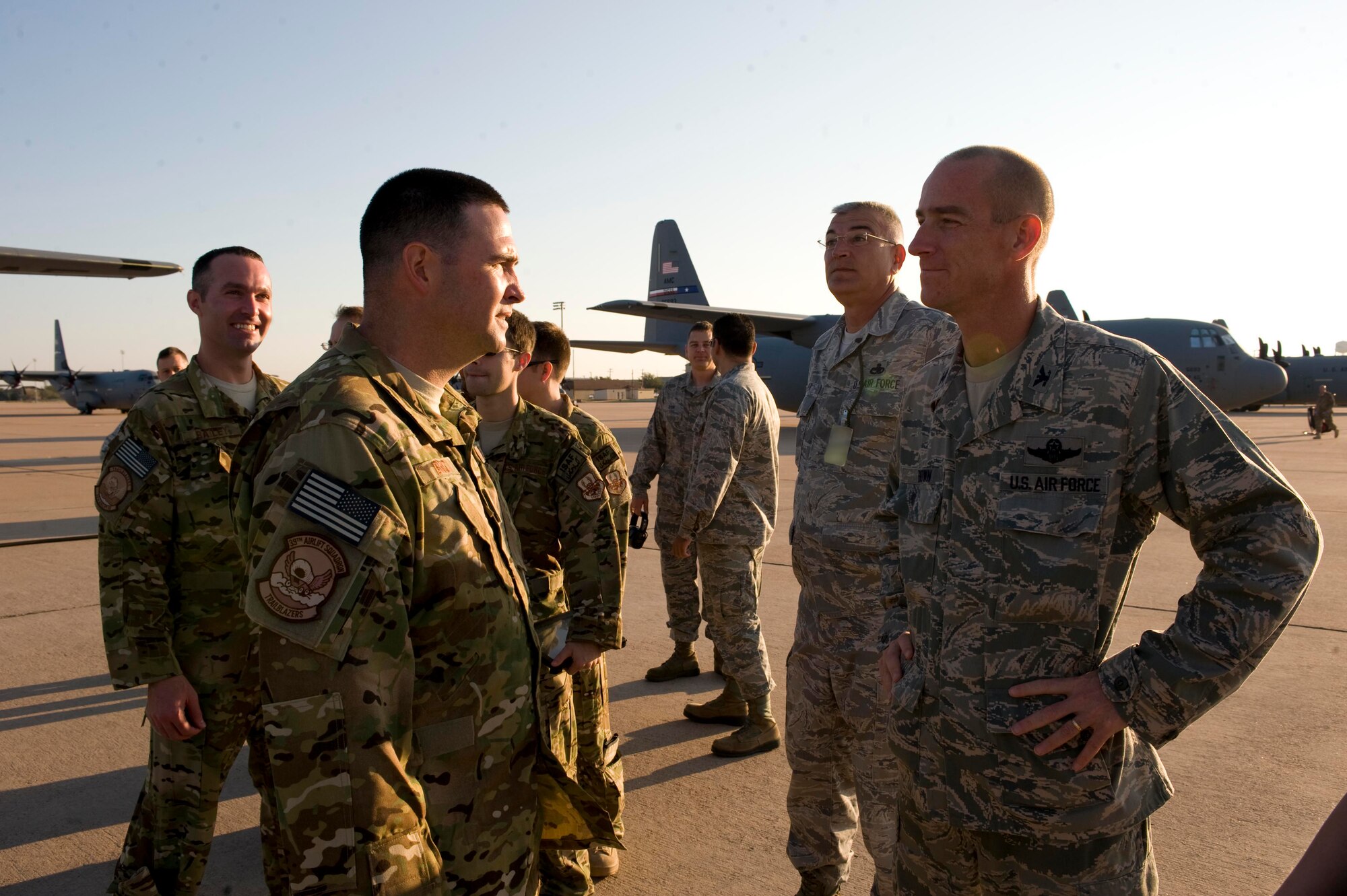 U.S. Air Force Lt. Col. Michael Brock, left, 39th Airlift Squadron commander, receives final words of encouragement from Col. Jeffrey Brown, 317th Airlift Group commander, Sept. 3, 2013, at Dyess Air Force Base, Texas.  The 39th Airlift Group recently deployed more than 180 Airmen in support of U.S. Central Command missions. (U.S. Air Force photo by Airman 1st Class Kylsee Wisseman)