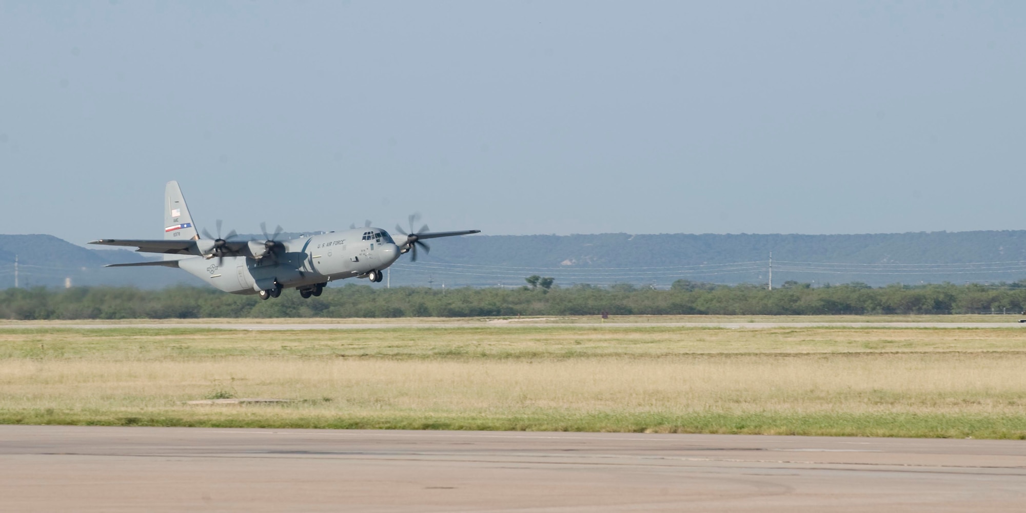 A C-130 J-model from the 317th Airlift Group takes off Sept. 3, 2013, from Dyess Air Force Base, Texas. Members of the 39th Airlift Squadron recently deployed in support of U.S. Central Command. This is the first deployment that has had a complete fleet of C-130 J-model aircraft from the 317th AG. (U.S. Air Force photo by Airman 1st Class Kylsee Wisseman)