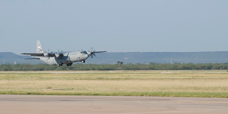 A C-130 J-model from the 317th Airlift Group takes off Sept. 3, 2013, from Dyess Air Force Base, Texas. Members of the 39th Airlift Squadron recently deployed in support of U.S. Central Command. This is the first deployment that has had a complete fleet of C-130 J-model aircraft from the 317th AG. (U.S. Air Force photo by Airman 1st Class Kylsee Wisseman)