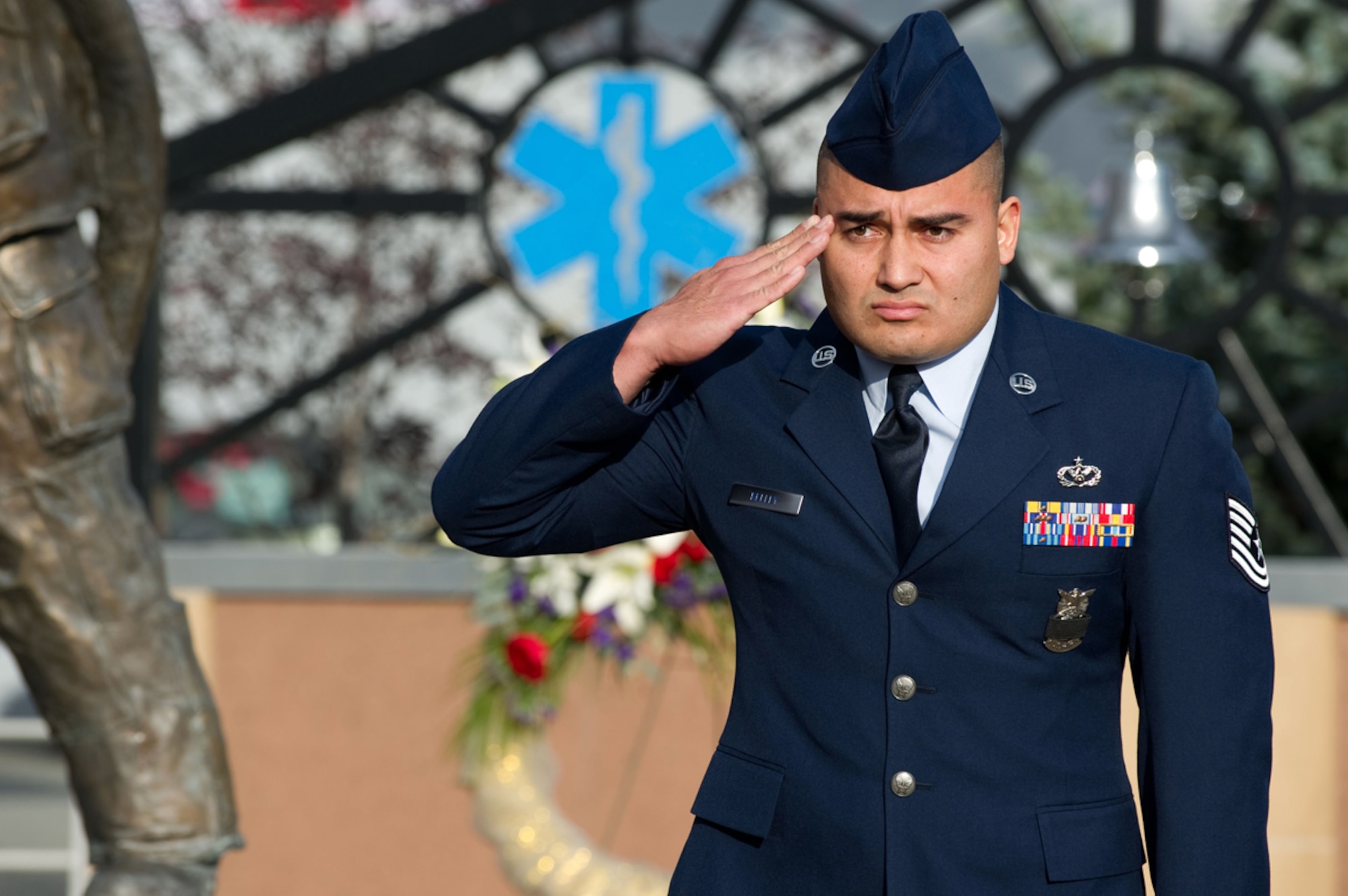 Tech. Sgt. Keenan Kelley, 673rd Civil Engineer, battalion chief, salutes during the national anthem Sept. 11, at the Alaska Fallen Firefighter Memorial Ceremony and 9/11 Remembrance ceremony held at the Alaska Fallen Firefighter Memorial. (U.S. Air Force photo/Tech. Sgt. Chris Mills)