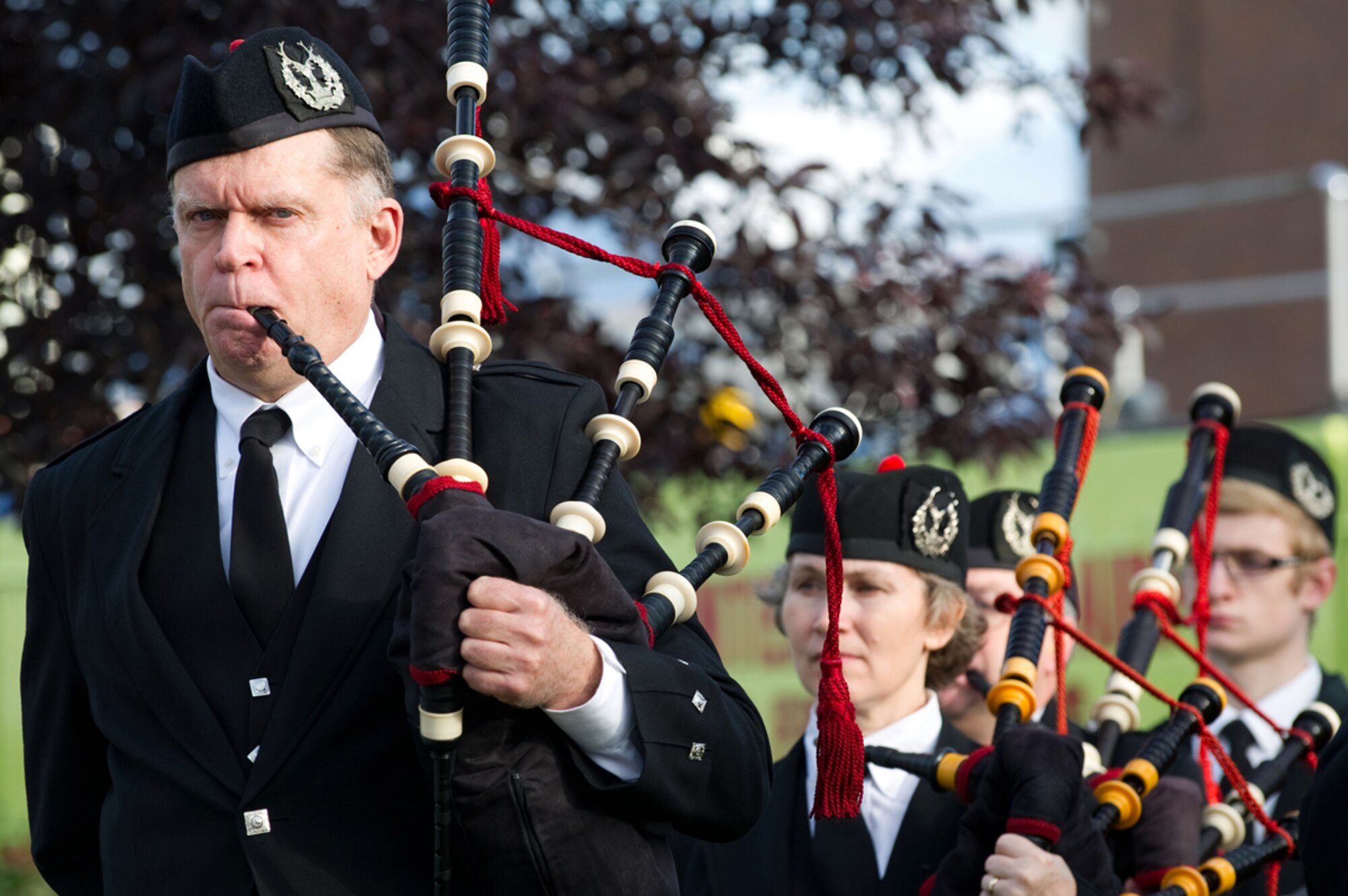 Joe Albrecht, Pipe Sgt. for the Crow Creek Pipes and Drums, plays during the Alaska Fallen Firefighter Memorial Ceremony and 9/11 Remembrance Sept. 11, at the Alaska Fallen Firefighter Memorial. Bag pipes became associated with fire and police departments during the 1800s after in influx of Scottish and Irish immigrated to the U.S. (U.S. Air Force photo/Tech. Sgt. Chris Mills) 