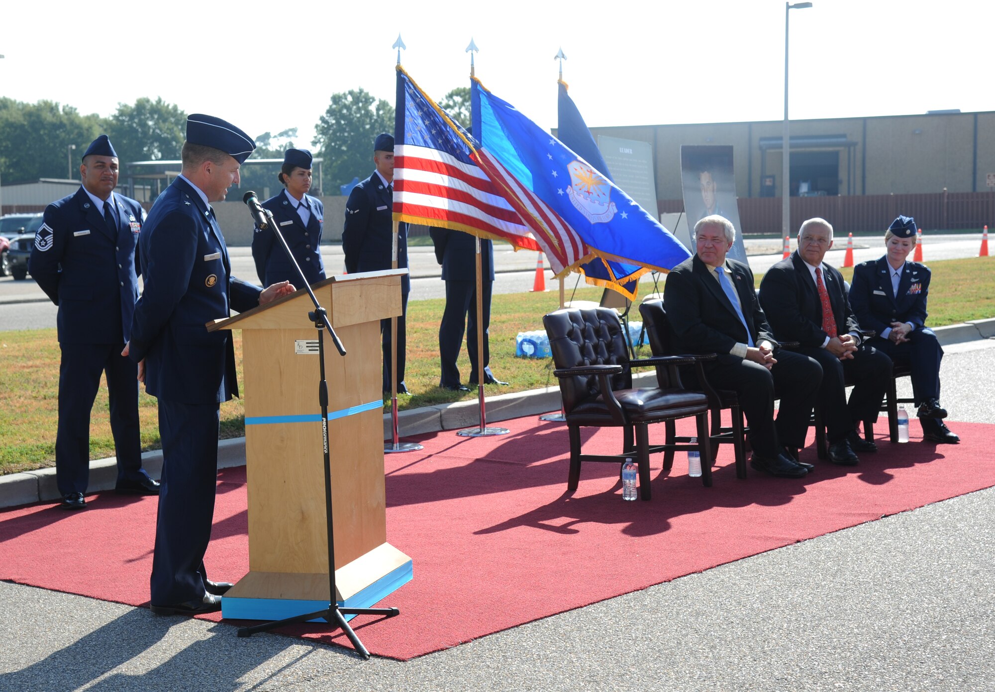 Brig. Gen. Patrick Higby, 81st Training Wing commander, delivers remarks during the street dedication ceremony honoring a former technical training student, Chief Master Sgt. Richard Etchberger, Sept. 16, 2013, Keesler Air Force Base, Miss. Etchberger posthumously received the Medal of Honor, the U.S. military’s highest decoration, in 2010. His son, Cory Etchberger, assisted with the unveiling of a street sign and a memorial stone at the event.  (U.S. Air Force photo by Kemberly Groue)