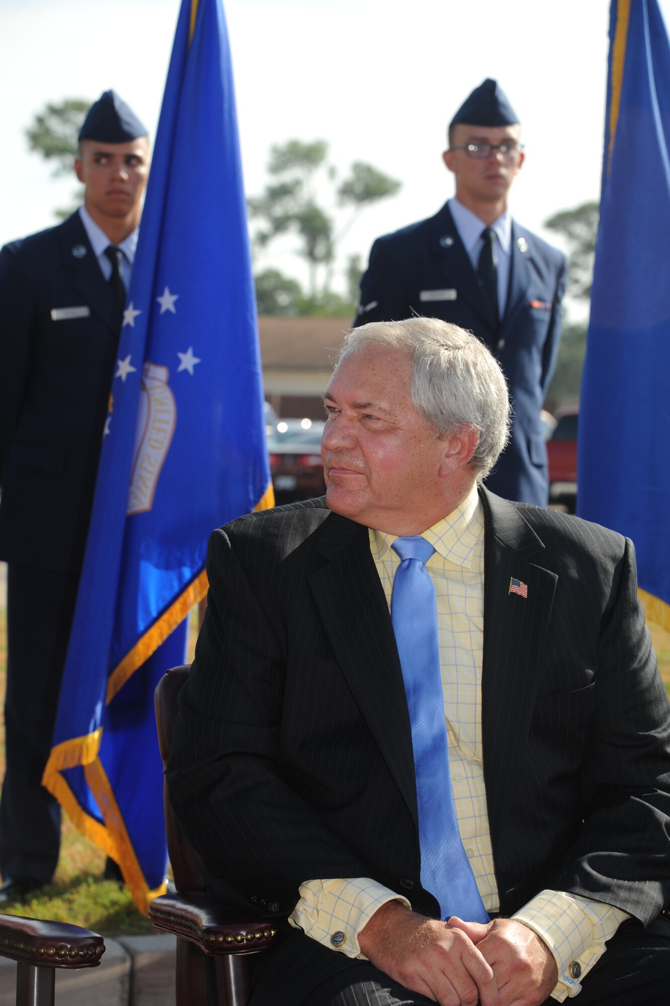 Cory Etchberger, son of former technical training student, Chief Master Sgt. Richard Etchberger, listens to speakers during the street dedication ceremony honoring his father Sept. 16, 2013, Keesler Air Force Base, Miss. Etchberger posthumously received the Medal of Honor, the U.S. military’s highest decoration, in 2010.  (U.S. Air Force photo by Kemberly Groue)