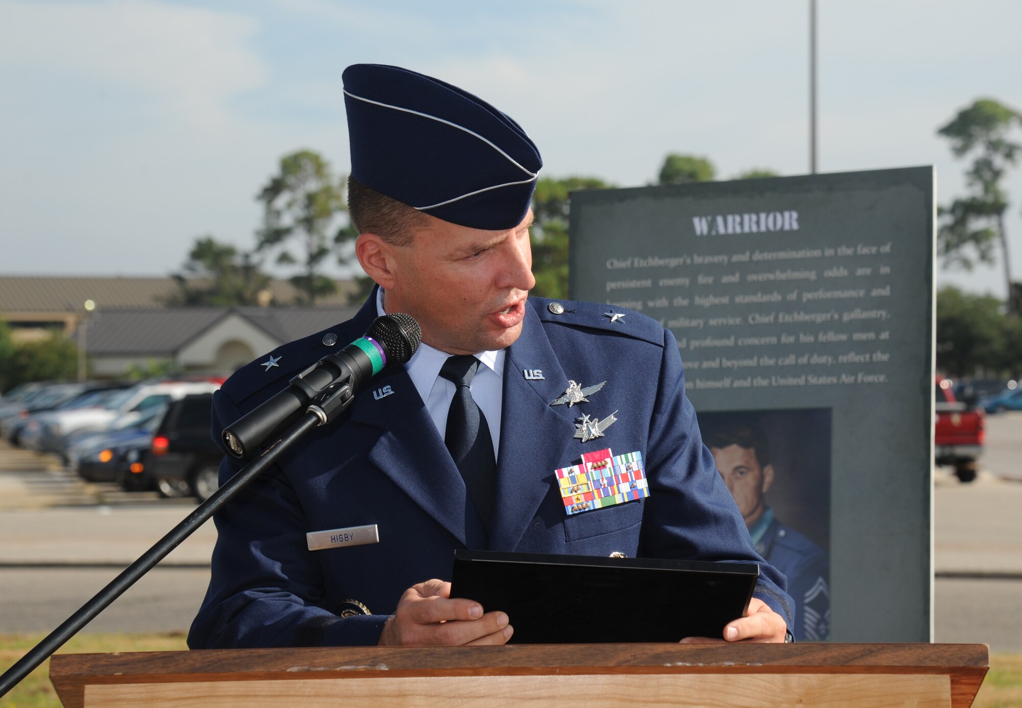 Brig. Gen. Patrick Higby, 81st Training Wing commander, delivers remarks during the street dedication ceremony honoring a former technical training student, Chief Master Sgt. Richard Etchberger, Sept. 16, 2013, Keesler Air Force Base, Miss. Etchberger posthumously received the Medal of Honor, the U.S. military’s highest decoration, in 2010. His son, Cory Etchberger, assisted with the unveiling of a street sign and a memorial stone at the event.  (U.S. Air Force photo by Kemberly Groue)