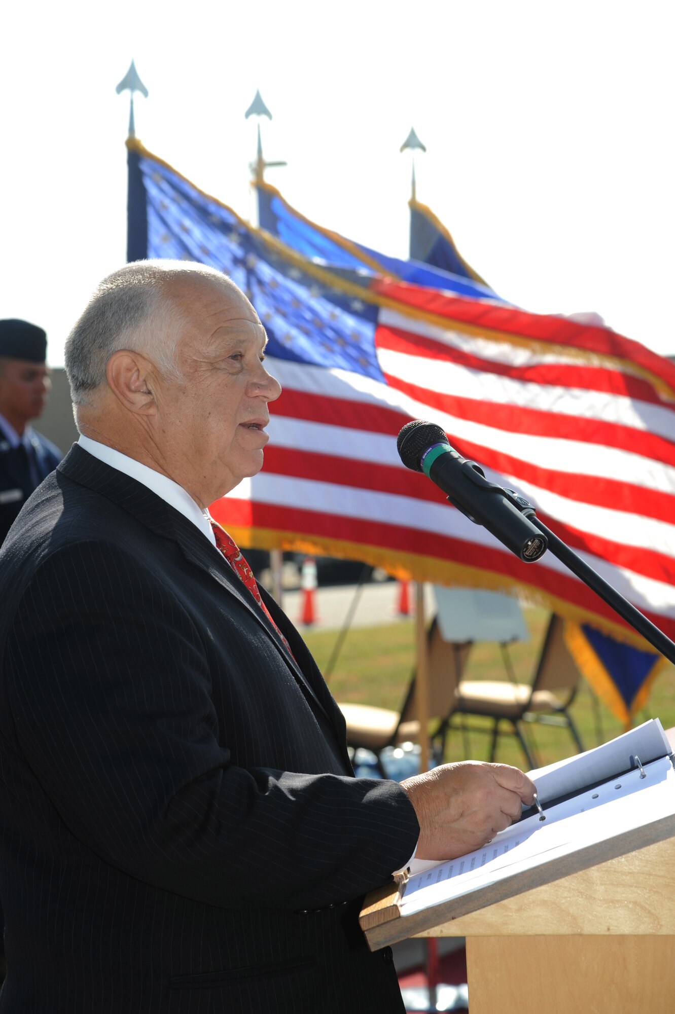 Retired Col. Joseph Panza, delivers remarks during the street dedication ceremony honoring a former technical training student, Chief Master Sgt. Richard Etchberger, Sept. 16, 2013, Keesler Air Force Base, Miss. Panza was the helicopter pilot for the rescue mission when Etchberger was credited with saving three comrades before he was killed. Etchberger posthumously received the Medal of Honor, the U.S. military’s highest decoration, in 2010.  (U.S. Air Force photo by Kemberly Groue)