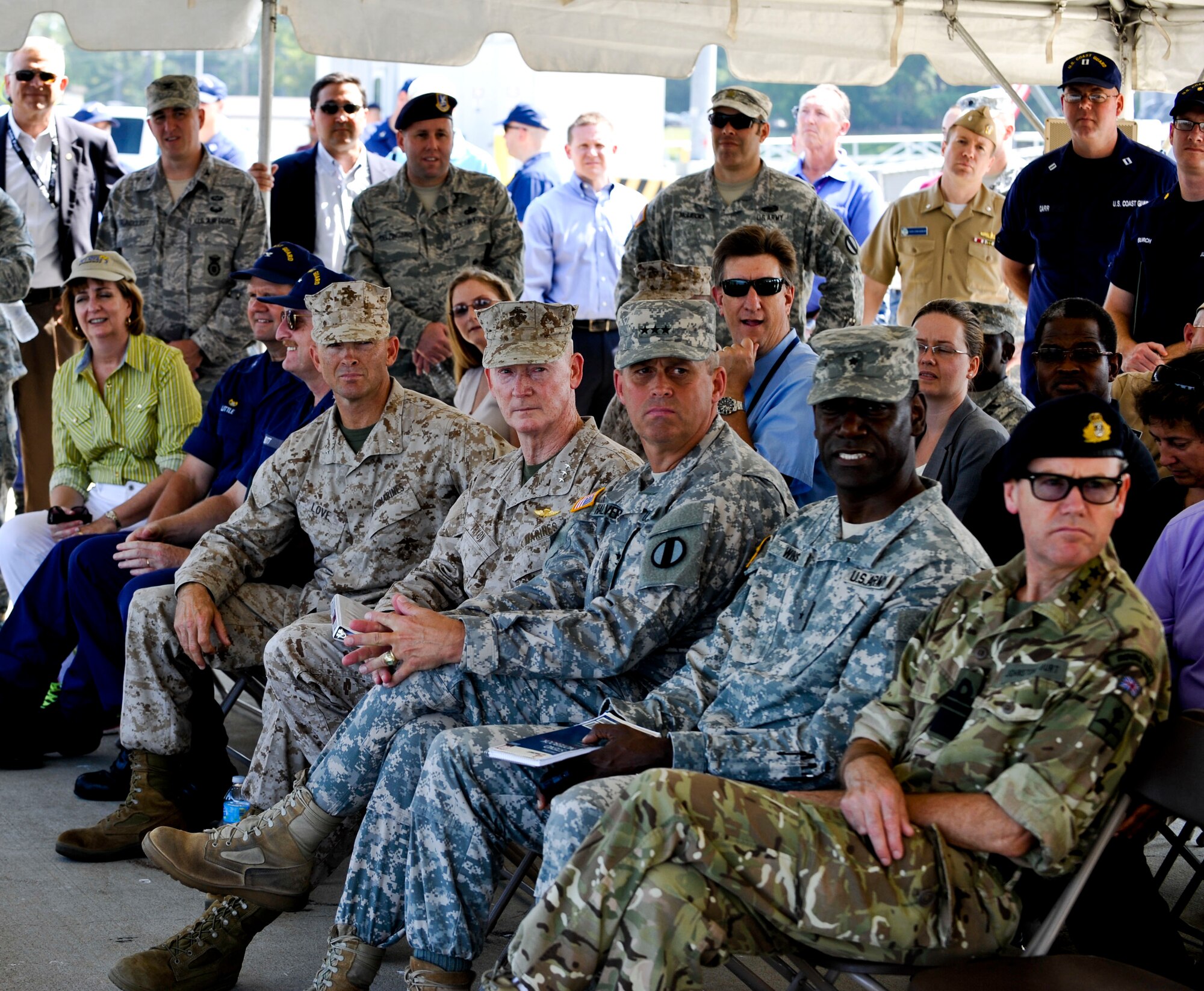 Service members, Department of Defense civilians, and members of the House Armed Services Committee watch a demonstration of the Active Denial System at Fort Eustis, Va., Sept. 12, 2013. The ADS can be used (in a maritime environment) to prevent vessels from entering a port, allowing Service members to engage threats at a longer range with non-lethal capabilities. (U.S. Air Force photo by Staff Sgt. Wesley Farnsworth/Released)