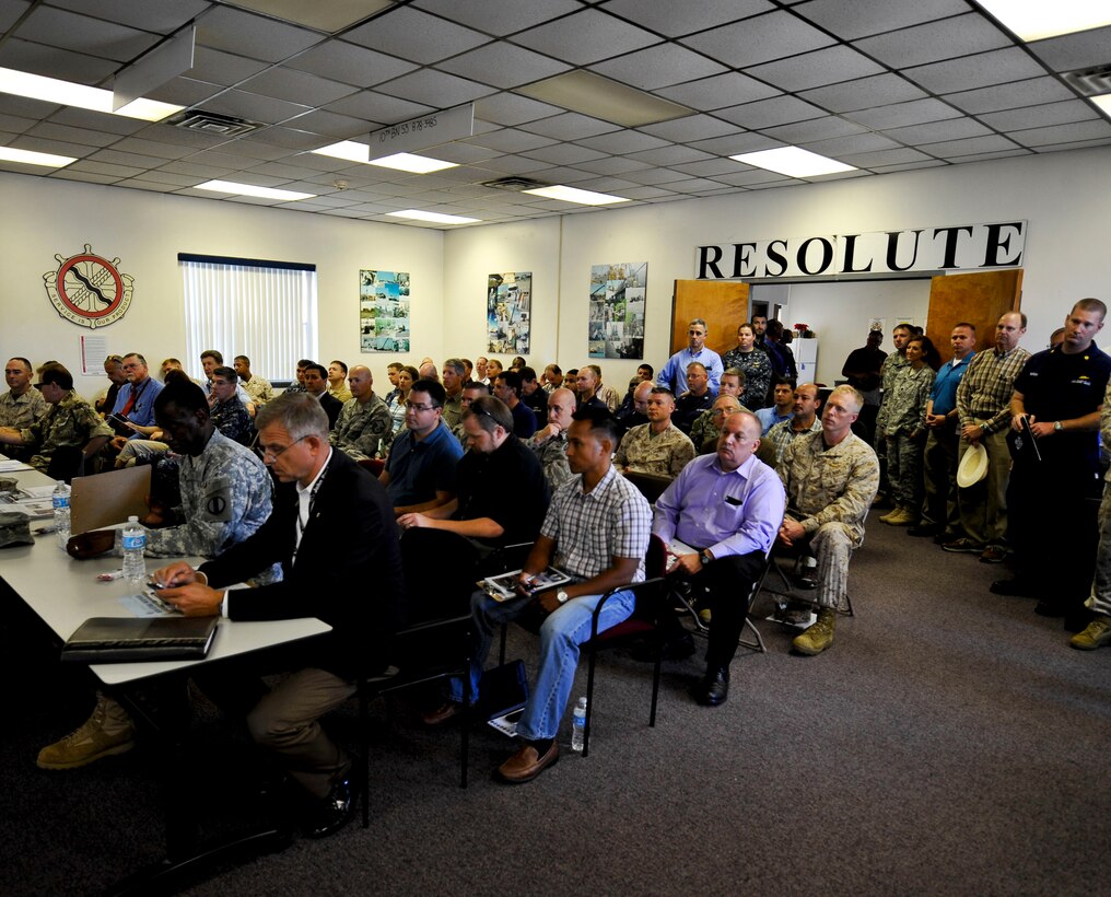Service members, Department of Defense civilians and members of the House Armed Services Committee gather for a capabilities briefing of the Active Denial System at Fort Eustis, Va., Sept. 12, 2013. With more than 15 years of research and exposing 11,800 volunteers, the ADS system has demonstrated its effectiveness and the ability to use it with minimal risk of injury. (U.S. Air Force photo by Staff Sgt. Wesley Farnsworth/Released)