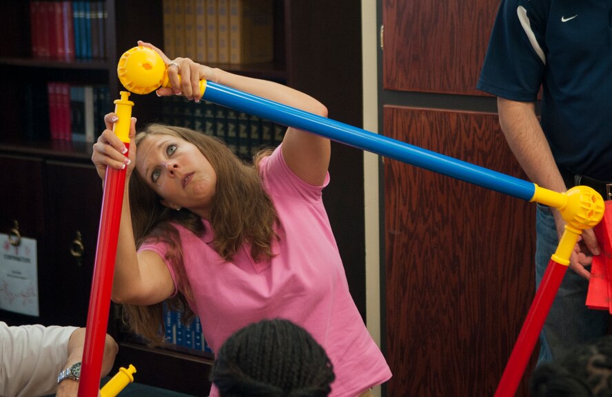 U.S. Air Force Tech. Sgt. Jessica Gramlick, 23d Wing Chapel NCO in charge of Chapel administration, assembles a maze as part of a workplace communication class at Moody Air Force Base, Ga., Sept. 9, 2013. The goal was to build and navigate the maze as a team. (U.S. Air Force photo by Airman 1st Class Sandra Marrero/Released)
