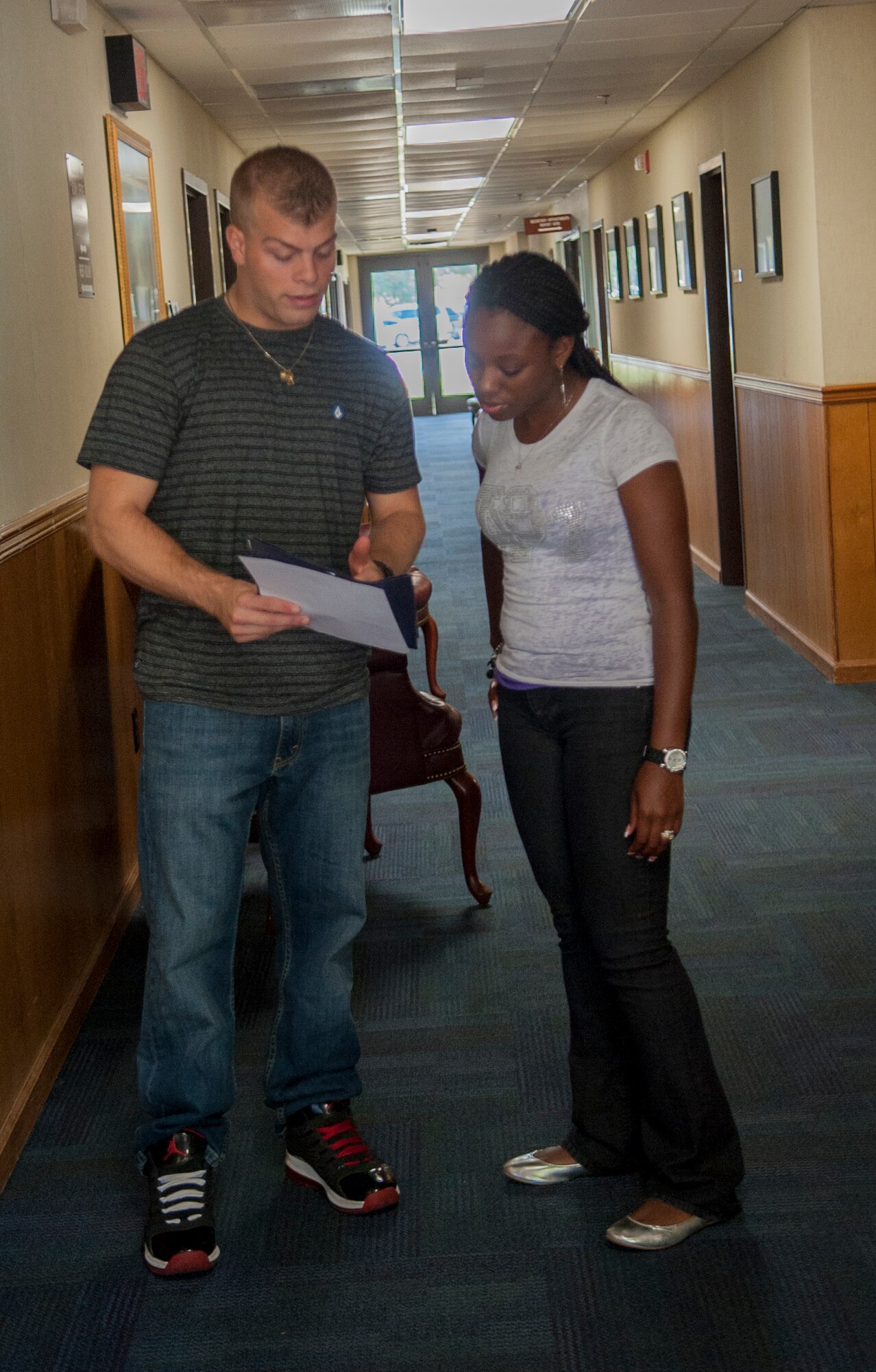 U.S. Air Force Senior Airman Jordan Sager, 23d Medical Group mental health technician, gives Staff Sgt. Erica Mitchell, 23d Wing Chapel chaplain assistant, limited instructions on how to build a maze during a workplace communication class at Moody Air Force Base, Ga., Sept. 9, 2013. Mitchell was chosen to relay the information to her coworkers to test their communication skills. (U.S. Air Force photo by Airman 1st Class Sandra Marrero/Released) 
