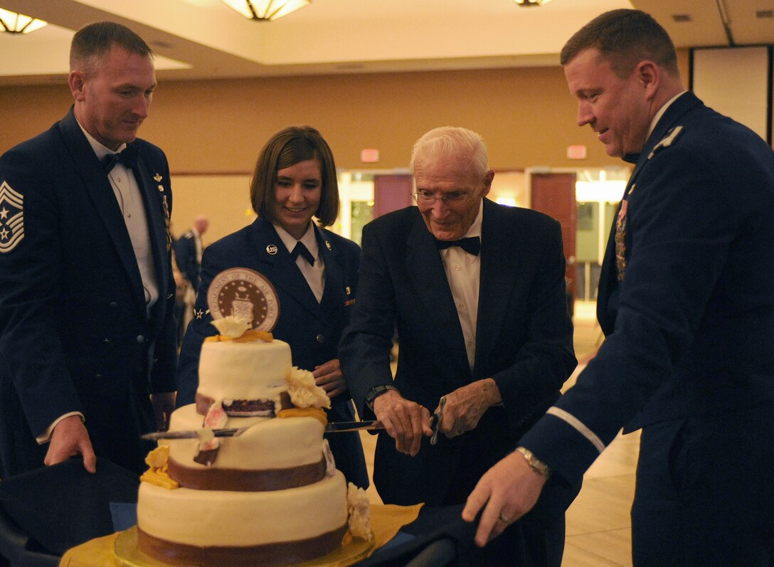 U.S. Air Force Col. Tony Bauernfeind, 27th Special Operations Wing commander, and Chief Master Sgt. Paul Henderson, 27 SOW command chief, help cut the Air Force birthday cake Sept. 14, 2013 at the Air Force Ball held at the Clovis Civic Center in Clovis, N.M. The Air Force Ball is an annual celebration held in honor of the day the Air Force became a separate branch of service. (U.S. Air Force photo/Senior Airman Ericka Engblom)