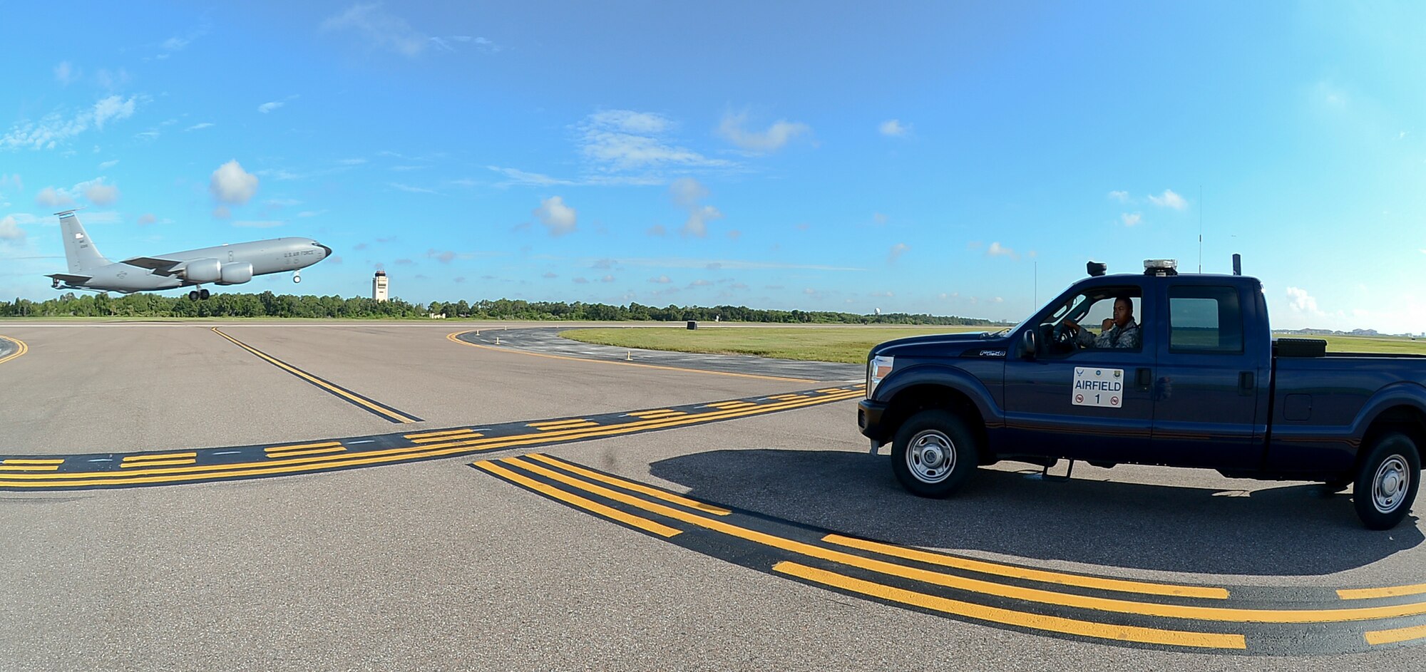 Airman 1st Class Issac Butler, 6th Operations Support Squadron airfield management coordinator, waits for a KC-135 Stratotanker to take off before entering the runway at MacDill Air Force Base, Fla., Sept. 12, 2013.  Airfield management operations provides a safe airfield environment for the KC-135, supporting transit aircraft, distinguished visitors for two unified combatant commands, as well as the National Oceanic and Atmospheric Administration Aircraft Operations Center. (U.S. Air Force photo by Senior Airman Melanie Bulow-Kelly/Released)