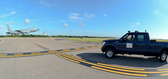 Airman 1st Class Issac Butler, 6th Operations Support Squadron airfield management coordinator, waits for a KC-135 Stratotanker to take off before entering the runway at MacDill Air Force Base, Fla., Sept. 12, 2013.  Airfield management operations provides a safe airfield environment for the KC-135, supporting transit aircraft, distinguished visitors for two unified combatant commands, as well as the National Oceanic and Atmospheric Administration Aircraft Operations Center. (U.S. Air Force photo by Senior Airman Melanie Bulow-Kelly/Released)