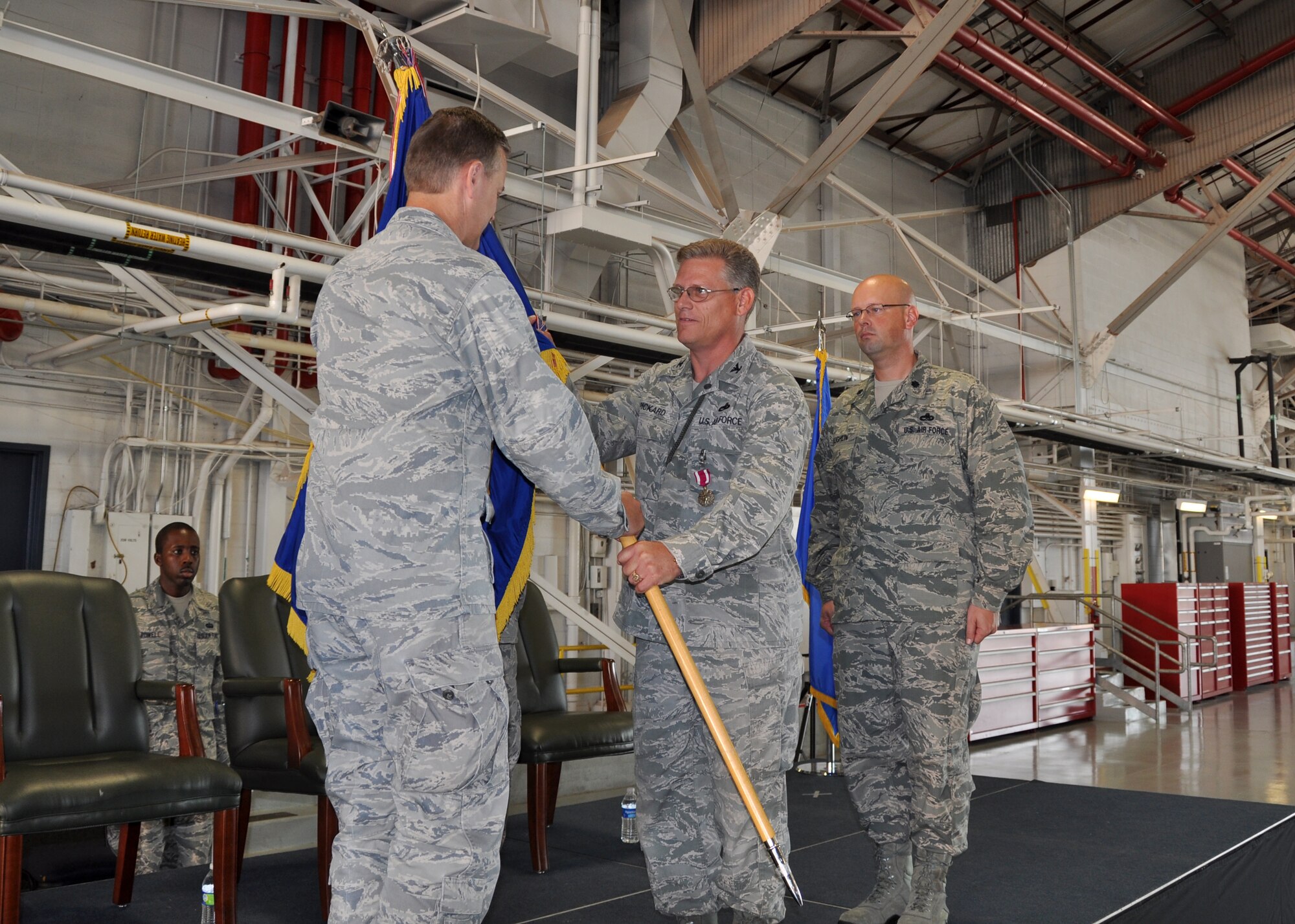 Outgoing Maintenance Group Commander, Col. Jeff Pickard, center, relenquishes command of the 507th Maintenance Group during a change of command ceremony here September September 8, 2013.  Col. Pickard took command of the 507th MXG in 2011 and is leaving to take command of the 349th Maintenance Group, Travis AFB Calif.  (U.S. Air Force photo/Maj. Jon Quinlan)