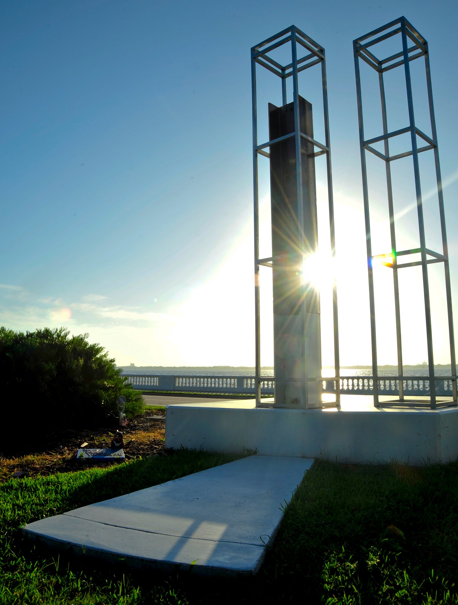 On the morning of Sept. 11, 2013, the sun shines on the Bayshore Boulevard 9/11 memorial in Tampa, Fla. The north tower, filled with a beam from the original tower, and south tower of the World Trade Center are represented by the memorial. (U.S. Air Force photo by Airman 1st Class Sarah Hall-Kirchner/Released)