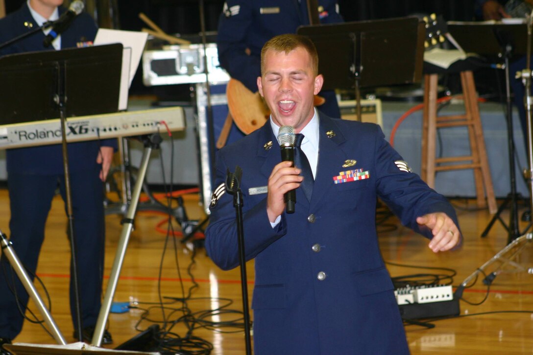 SRA Matt Adams sings Jason Mraz's popular song "I'm Yours" during a performance in Oneida, TN on June 23, 2013