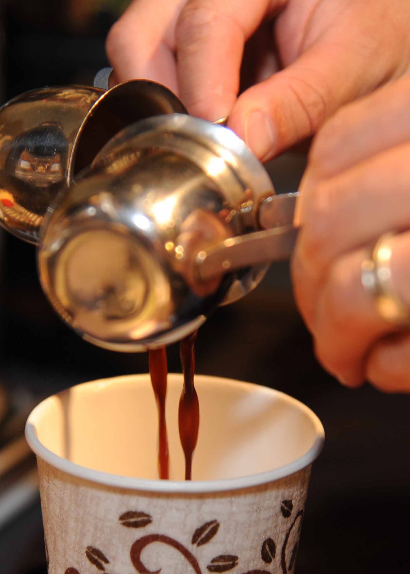 PETERSON AIR FORCE BASE, Colo. – Eric Rodman, Eclipse Cyber Café manager, prepares a latté Sept. 13 at the Café. The Cyber Café, located in building 1164, is a service provided by the base chapel and offers Airmen living in the dorms a cozy place to enjoy free coffee drinks and Italian sodas. Along with the drinks, the Cyber Café provides Wi-Fi, computer access and a variety of other services to the Airmen at no cost. (U.S. Air Force photo/Staff Sgt. Aaron Breeden)