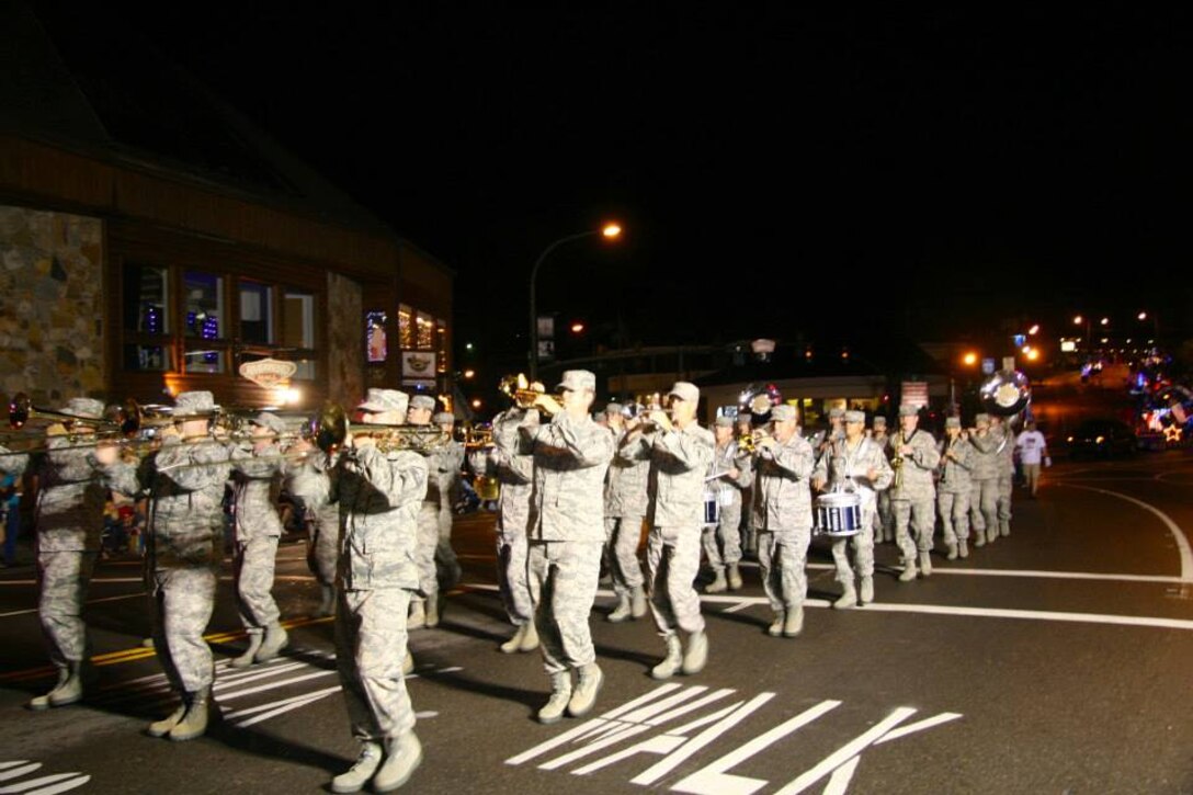 The Air National Guard Band of the Smoky Mountains Marching Band marches in the first Independence Day parade in the nation at 12:01am in Gatlinburg, TN on July 4, 2013