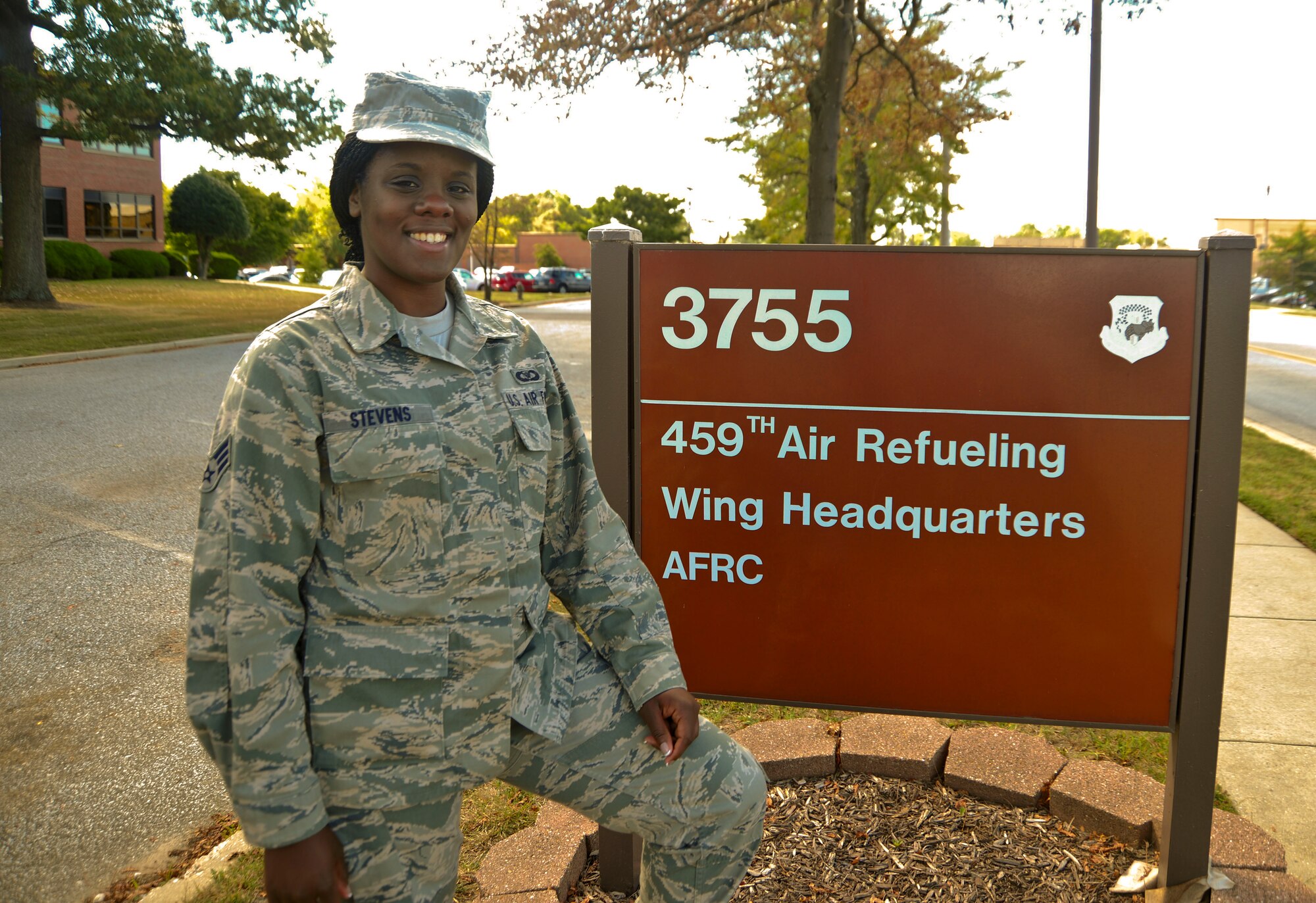 U.S. Air Force Senior Airman Alisha Stevens, poses for a picture in front of the headquarters building at the 459th Air Refueling Wing, Joint Base Andrews, Md., September 14, 2013. Stevens is a new member to the wing and works in the 459 ARW command post. (U.S. Air Force photo/ Staff Sgt. Amber Russell)
