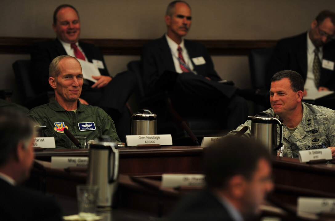 U.S. Air Force Gen. Mike Hostage, Air Combat Command commander, engages in a discussion regarding future initiatives, during the ACC Air Superiority Innovation Summit, at Langley Air Force Base, Va., Sept. 12, 2013. During the summit, several programs were measured against the projected future operating environment of the Air Force. (U.S. Air Force photo by Staff Sgt. Jarad A. Denton/Released)