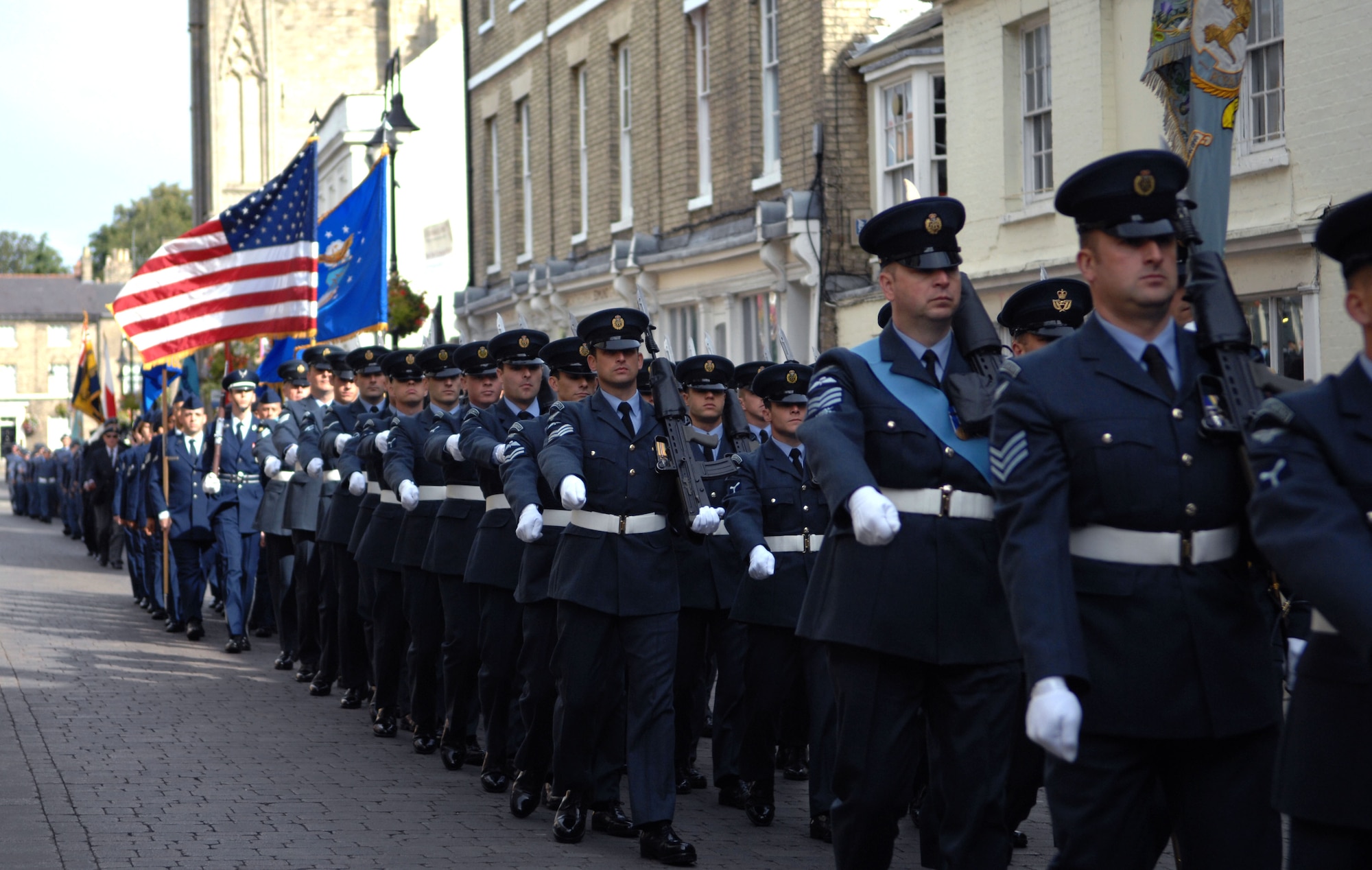 Royal Air Force and Team Mildenhall members march Sept. 15, 2013, during the Battle of Britain memorial parade in Bury St. Edmunds, England. The parade paid tribute to the battle the Royal Air Force fought in 1940 against the Luftwaffe. The parade started in the Abbey Gardens and proceeded to the cathedral where a memorial service was held. The service honored those who died during the Battle of Britain. (U.S. Air Force photo by Airman 1st Class Dillon Johnston/Released)