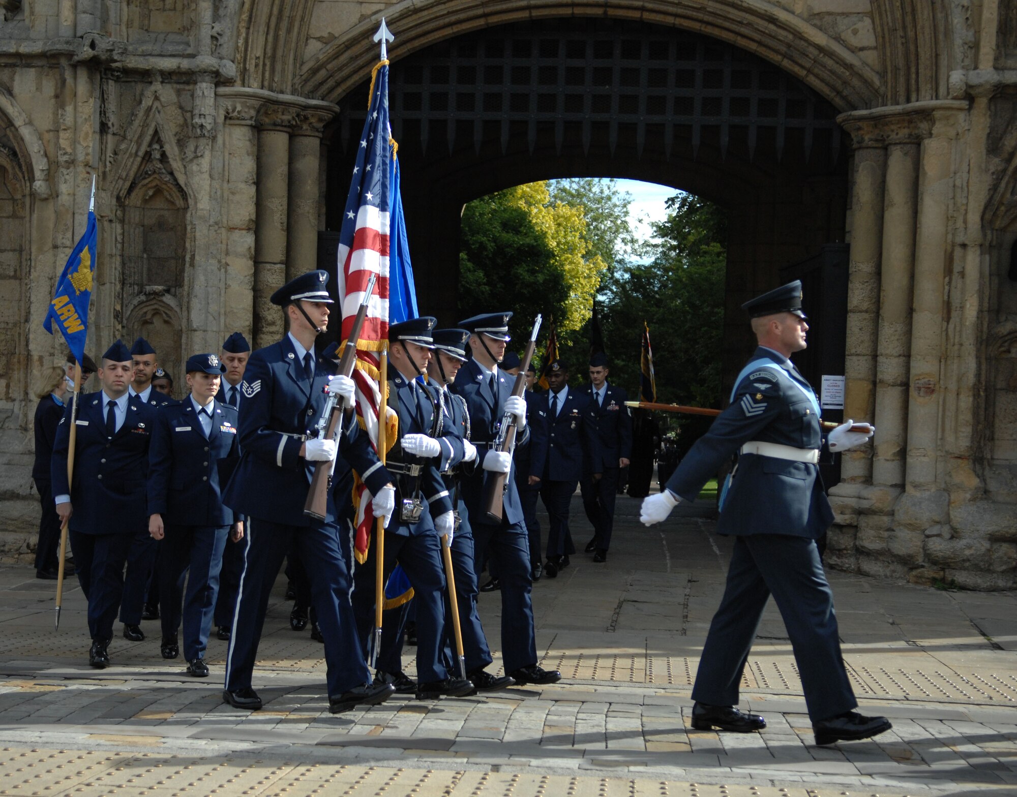 Team Mildenhall members begin their march toward the St. Edmundsbury Cathedral Sept. 15, 2013, during the Battle of Britain memorial parade in Bury St. Edmunds, England. The parade started in the Abbey Gardens and proceeded to the cathedral where a memorial service was held. The service honored those who died during the Battle of Britain. (U.S. Air Force photo by Airman 1st Class Dillon Johnston/Released)