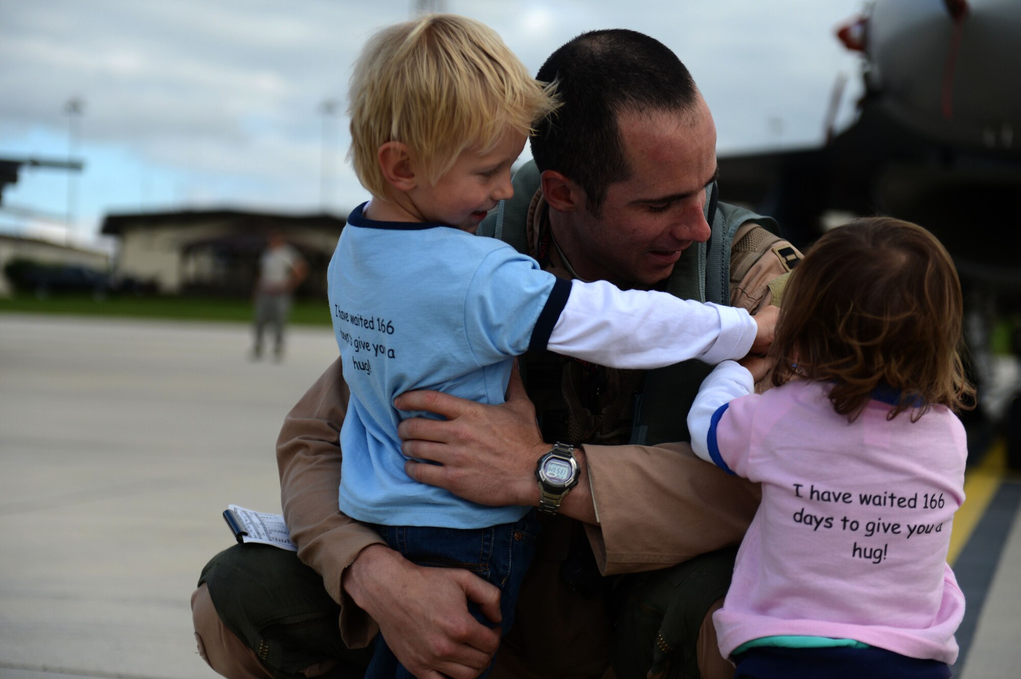 SPANGDAHLEM AIR BASE, Germany – U.S. Air Force Capt. Lance Ferguson, 480th Fighter Squadron pilot from Adrian, Mich., greets his family Sept. 15, 2013, after the squadron's deployment to an undisclosed location in Southwest Asia. The 480th FS Airmen and aircraft deployed in support of Operation Enduring Freedom. (U.S. Air Force photo by Airman 1st Class Gustavo Castillo/Released)