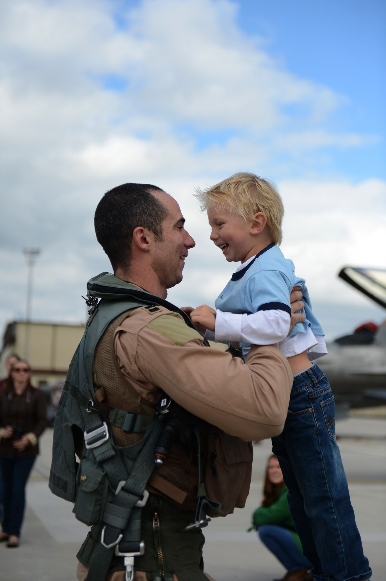 SPANGDAHLEM AIR BASE, Germany – U.S. Air Force Capt. Lance Ferguson, 480th Fighter Squadron pilot from Adrian, Mich., celebrates with his son, Liam during a deployment homecoming Sept 15, 2013. The 480th FS maintains ready forces to conduct a full range of operations in real-world scenarios. (U.S. Air Force photo by Airman 1st Class Gustavo Castillo/Released)