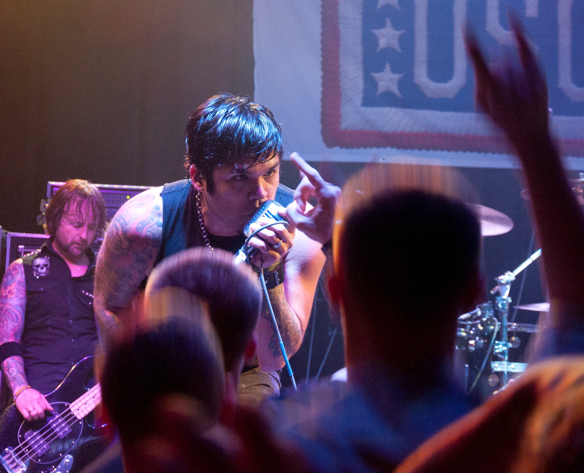 130911-F-GZ967-194 Jason Moreno, lead singer for the band Drowning Pool, sings to the crowd of Airmen during a performance Sept. 11, 2013. The band Drowning Pool played a free, USO-sponsored concert for the Airman, and their families, of F.E. Warren Air Force Base, Wyo., in the Fall Hall Community Center Sept. 11, 2013. (U.S. Air Force photo by Airman 1st Class Brandon Valle)