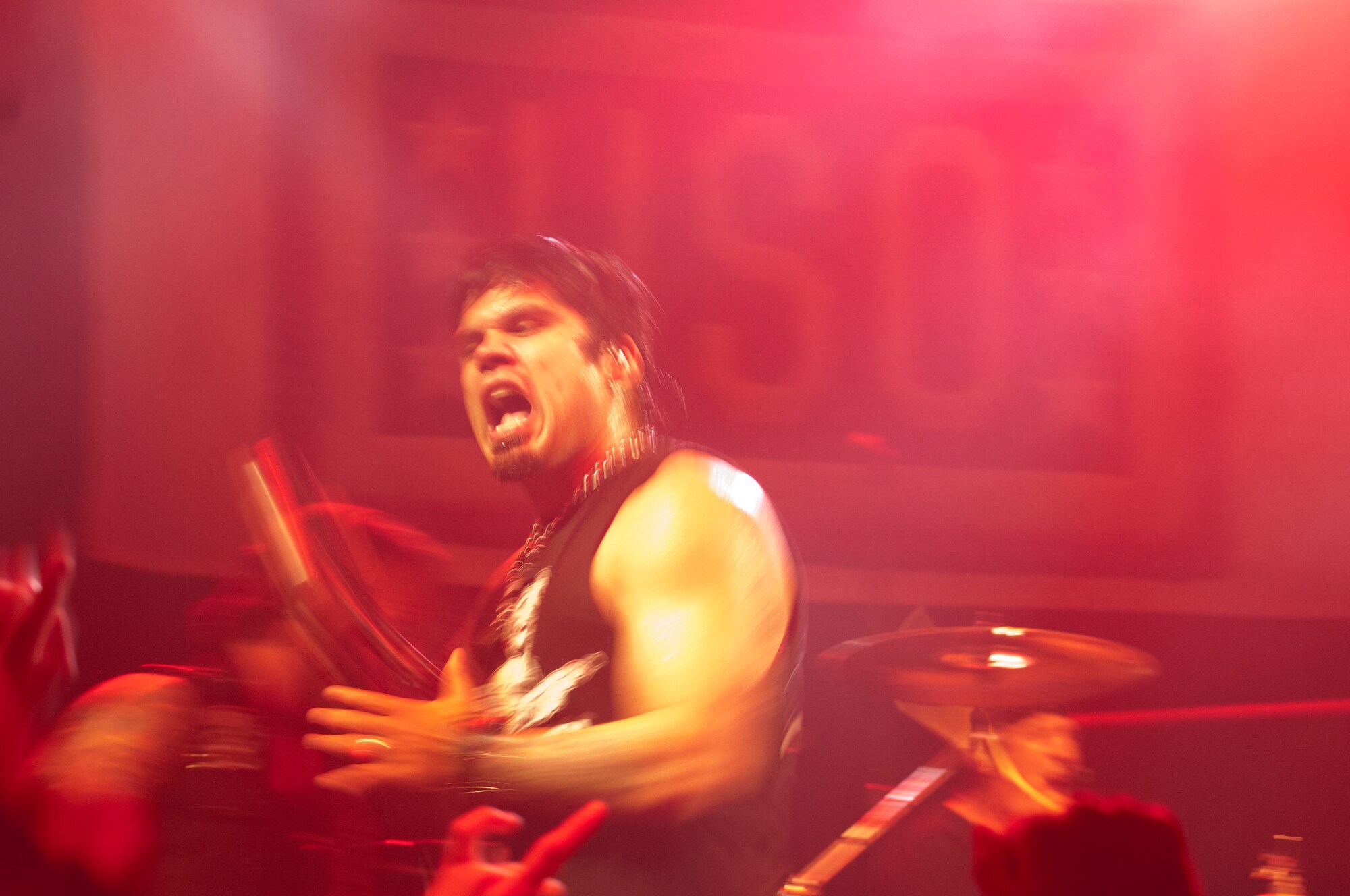 130911-F-GZ967-168 Jason Moreno, lead singer for the band Drowning Pool, shows his intensity during one of the songs the band performed Sept. 11, 2013. The band played a free, USO-sponsored concert at the Fall Hall Community Center of F.E. Warren Air Force Base, Wyo. (U.S. Air Force photo by Airman 1st Class Brandon Valle)