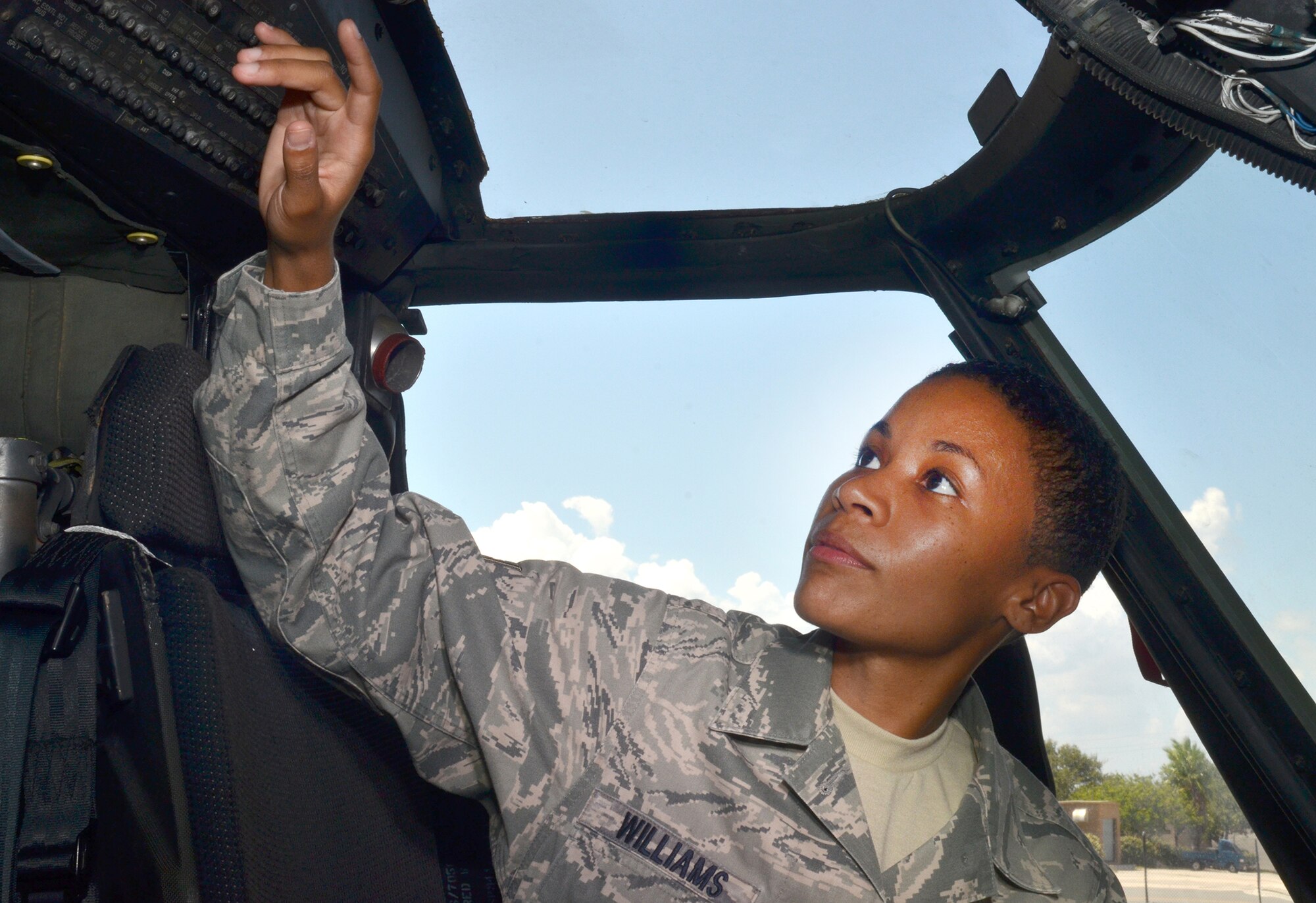 Staff Sgt. Jennafur Williams, integrated avionics guidance and control specialist, 920th Rescue Wing, performs checks on an HH-60G Pave Hawk rescue helicopter Sept. 8, at the 920th Rescue Wing, Williams became the wings first reservists to be awarded the John L. Levitow award after completing Airman Leadership School Aug. 29. (U.S. Air Force photo/Senior Airman Natasha Dowridge)