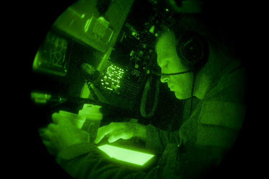 Staff Sgt. Ky Larkins, 384th Air Refueling Squadron boom operator, reviews the publications in route with an air refueling mission in southern Arizona, Sept. 13, 2013. The publications contain information about the A-10 receiver which will get the fuel. (U.S. Air Force photo/Airman 1st Class Colby L. Hardin)